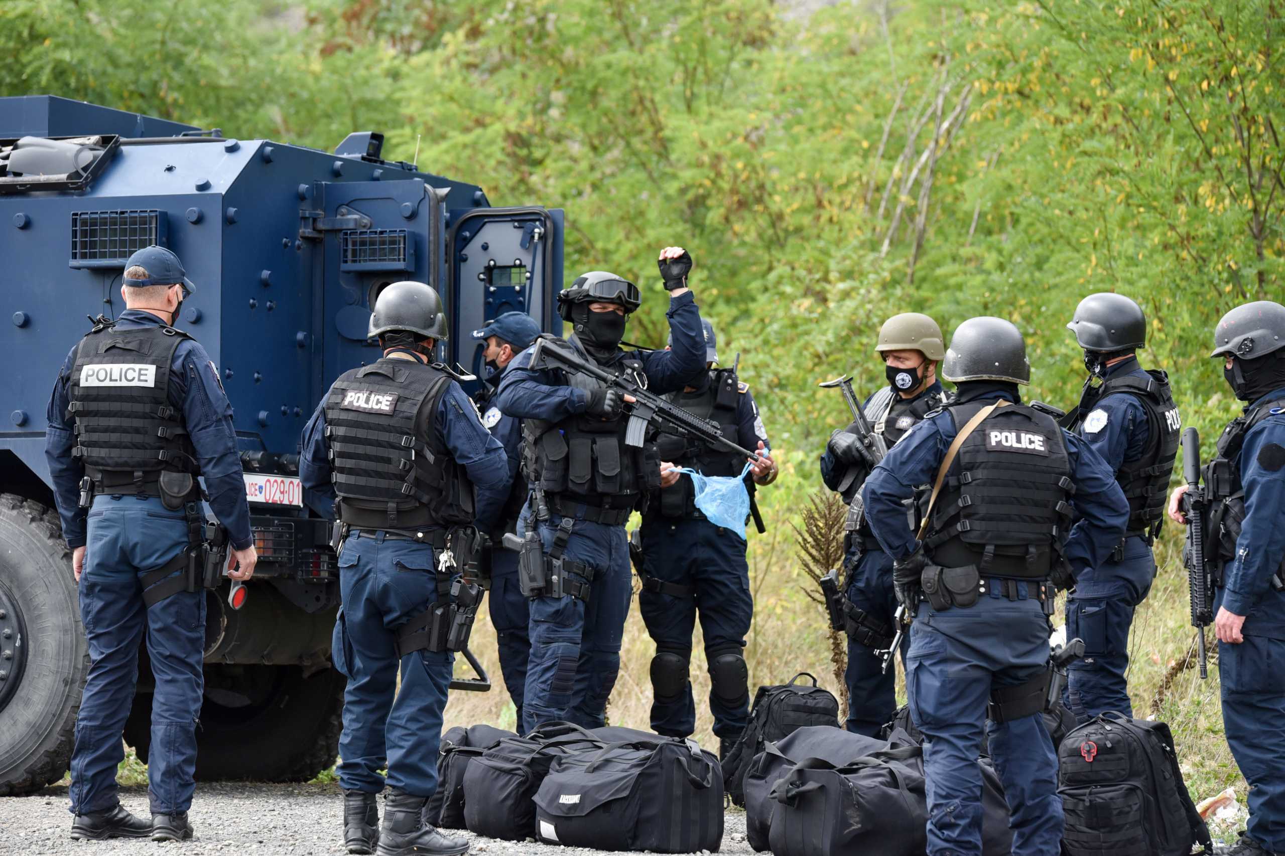 Kosovo special police with armoured vehicles are pictured as hundreds of Kosovo Serbs protest against a government ban on entry of vehicles with Serbian registration plates in Jarinje, Kosovo, September 21, 2021. REUTERS