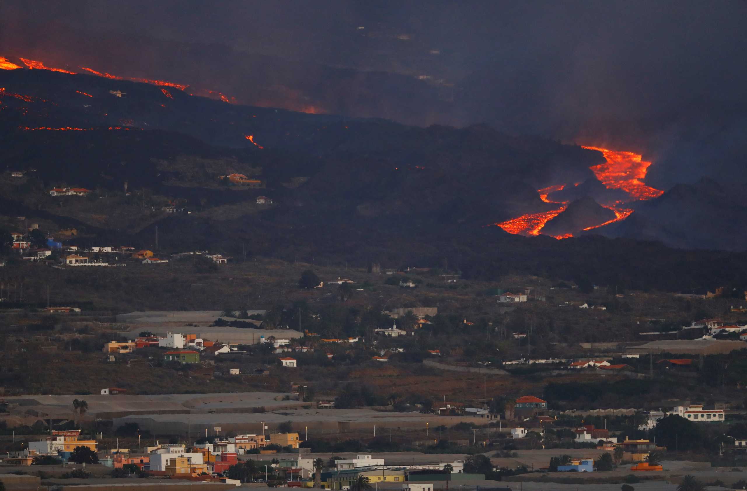 Lava flows, as seen from Tijarafe, following the eruption of a volcano on the Canary Island of La Palma, Spain, September 29, 2021. REUTERS