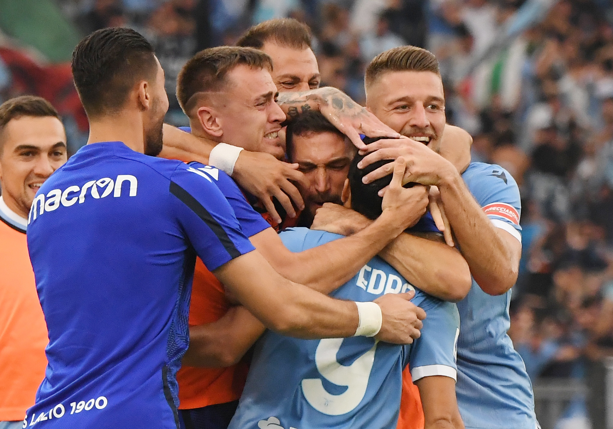 Soccer Football - Serie A - Lazio v AS Roma - Stadio Olimpico, Rome, Italy - September 26, 2021 Lazio's Pedro celebrates scoring their second goal with teammates REUTERS