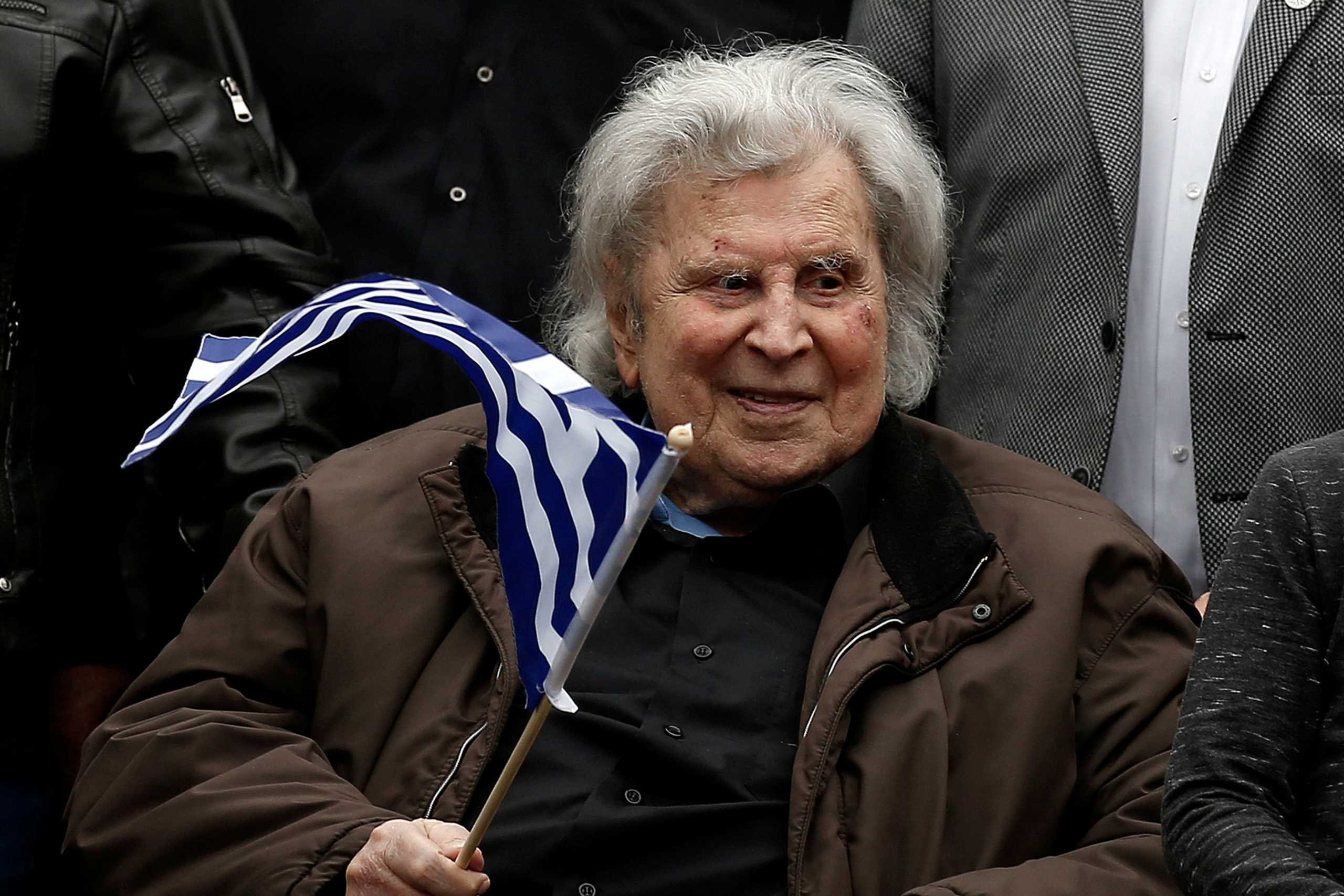 FILE PHOTO: Greek composer Mikis Theodorakis participates in a rally against the use of the term "Macedonia" in any settlement to a dispute between Athens and Skopje over the former Yugoslav republic's name, in Athens, Greece, February 4, 2018. REUTERS