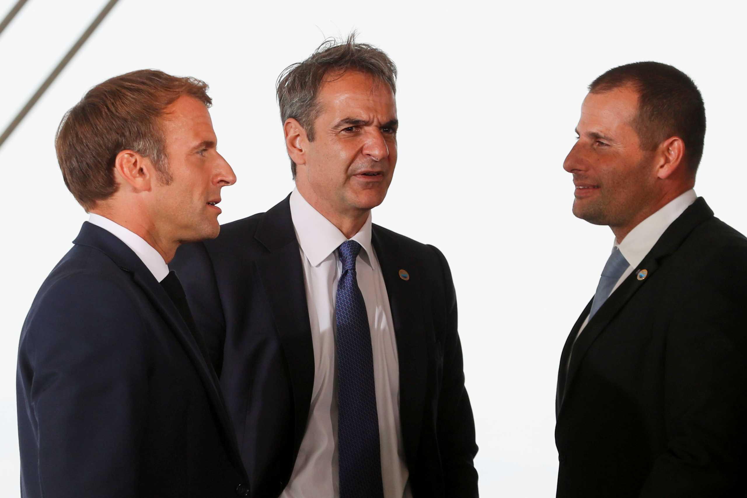 Greek Prime Minister Kyriakos Mitsotakis, Malta's Prime Minister Robert Abela and French President Emmanuel Macron talk as they meet for the 8th MED7 Mediterranean countries summit, in Athens, Greece, September 17, 2021. REUTERS