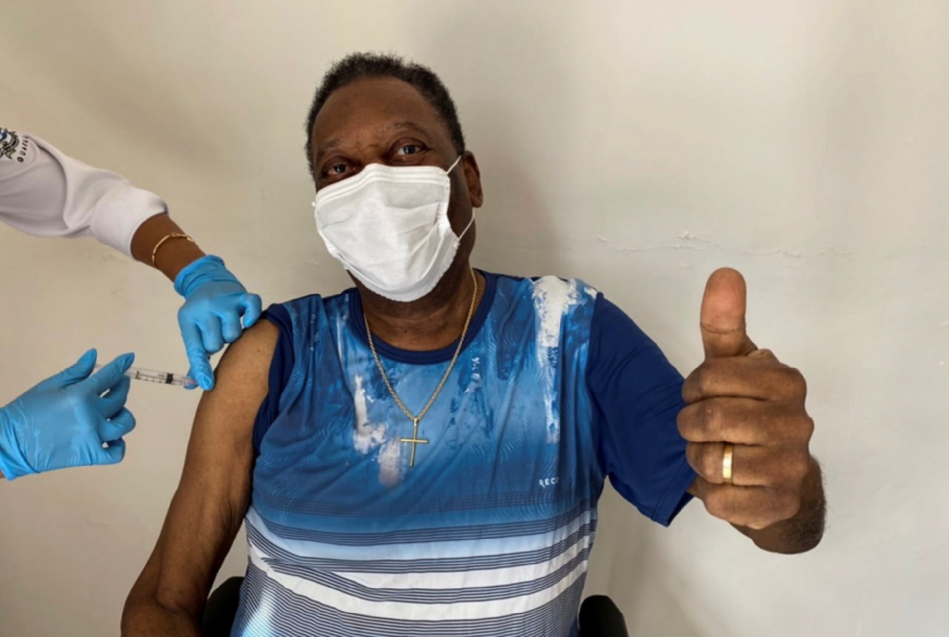 epa09047382 A handout photo made available by Advice of Pele showing former Brazilian soccer player Edson Arantes do Nascimento, known as 'Pele', while posing after receiving the vaccine against covid-19, in Sao Paulo, Brazil, 02 March 2021. Pele received 02 March the first dose of the covid-19 vaccine and celebrated the 'unforgettable' day with a photo shared on their social networks.  EPA