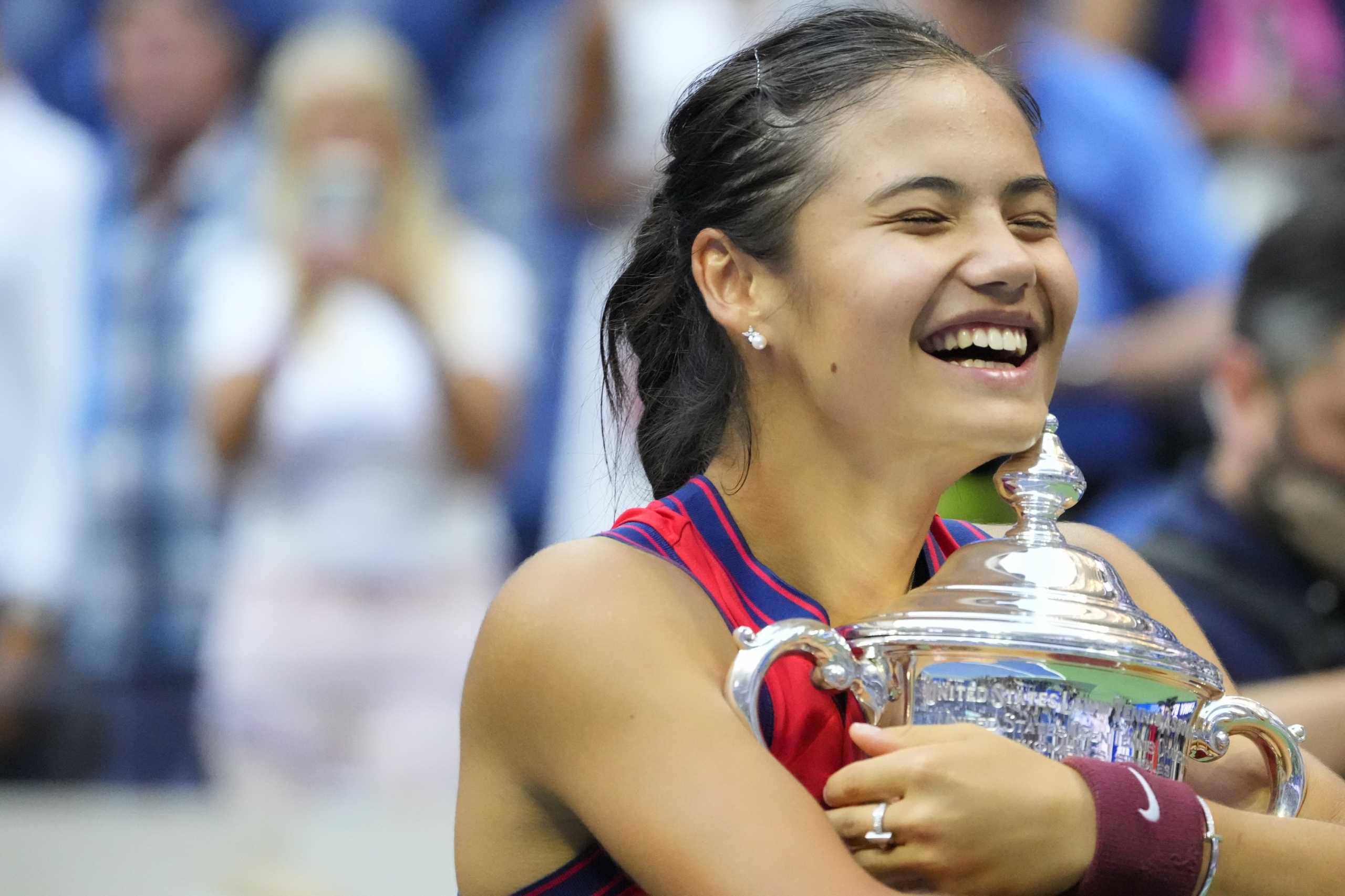 Sep 11, 2021; Flushing, NY, USA; Emma Raducanu of Great Britain celebrates with the championship trophy after her match against Leylah Fernandez of Canada (not pictured) in the women's singles final on day thirteen of the 2021 U.S. Open tennis tournament at USTA Billie Jean King National Tennis Center. Mandatory Credit: Robert Deutsch-USA TODAY Sports