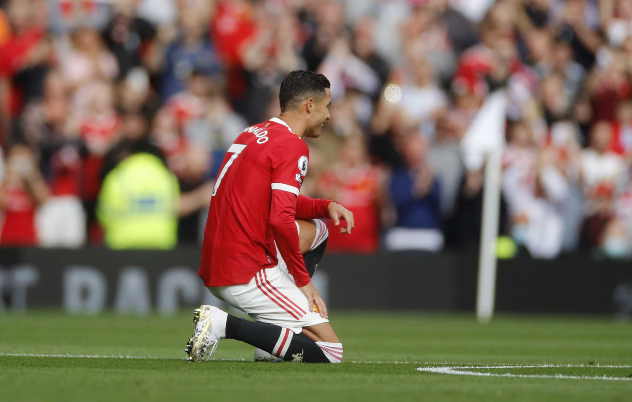 Soccer Football - Premier League - Manchester United v Newcastle United - Old Trafford, Manchester, Britain - September 11, 2021 Manchester United's Cristiano Ronaldo takes the knee before the match REUTERS
