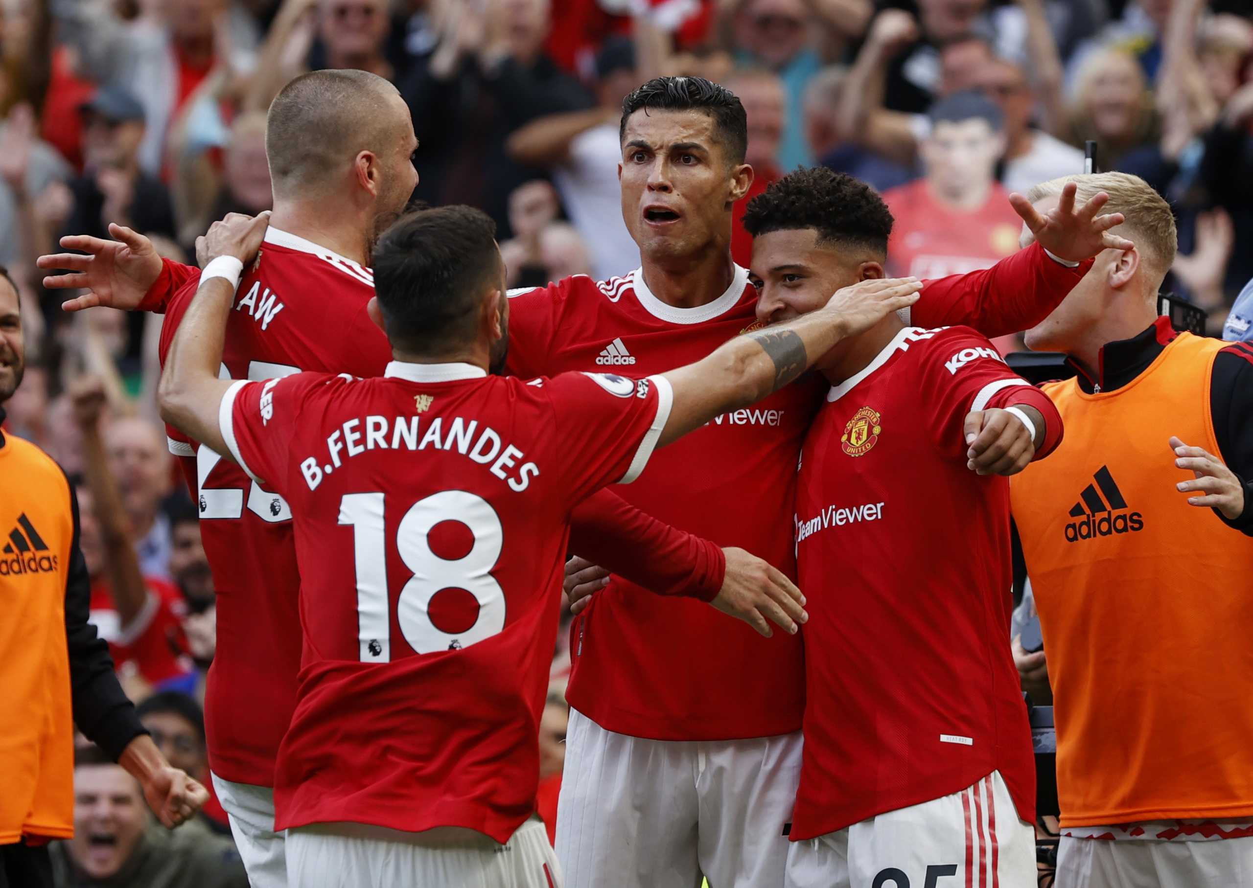 Soccer Football - Premier League - Manchester United v Newcastle United - Old Trafford, Manchester, Britain - September 11, 2021 Manchester United's Cristiano Ronaldo celebrates scoring their second goal with Jadon Sancho, Luke Shaw and Bruno Fernandes REUTERS