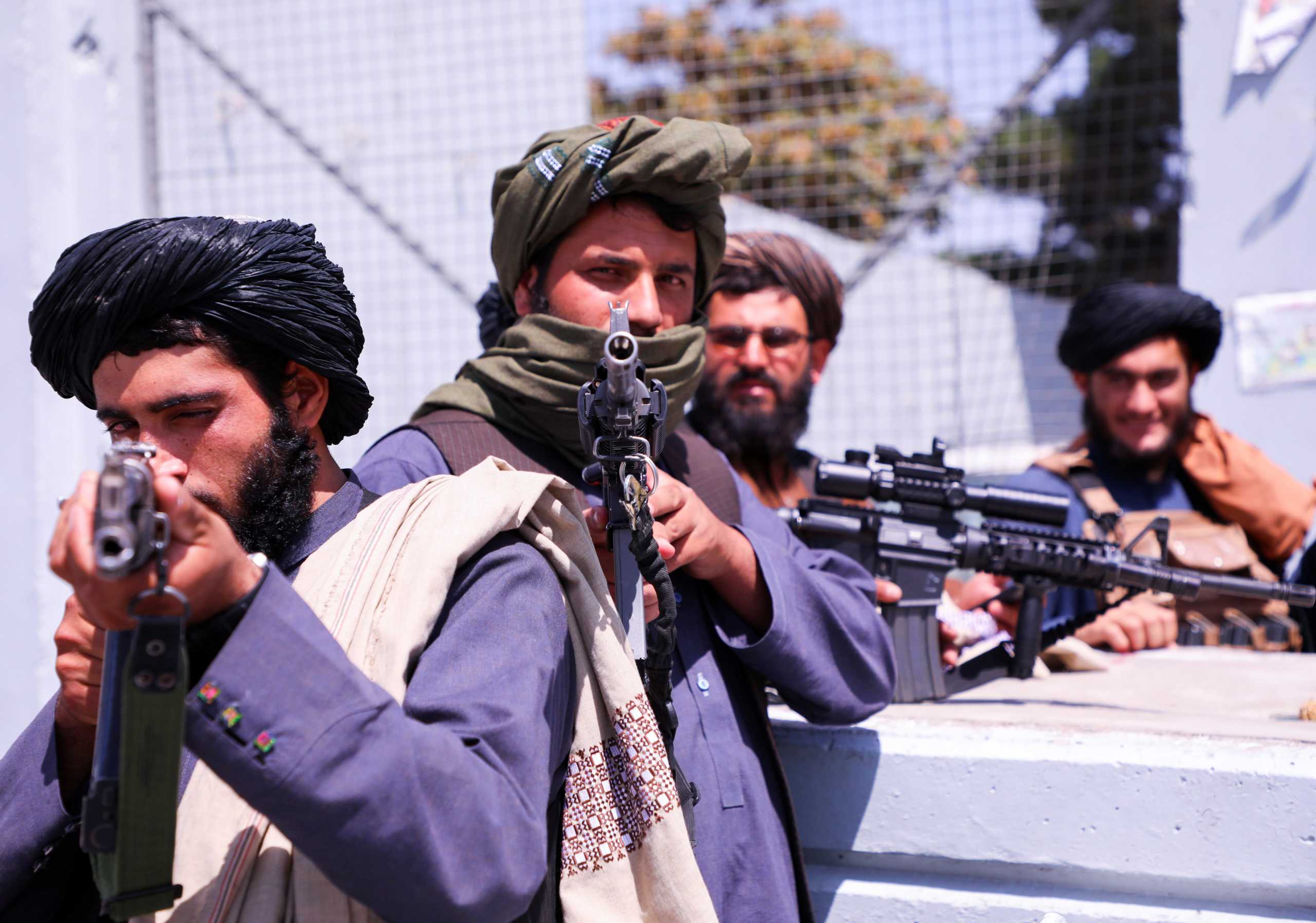 Taliban forces stand guard in front of Hamid Karzai International Airport in Kabul, Afghanistan, September 2, 2021. REUTERS