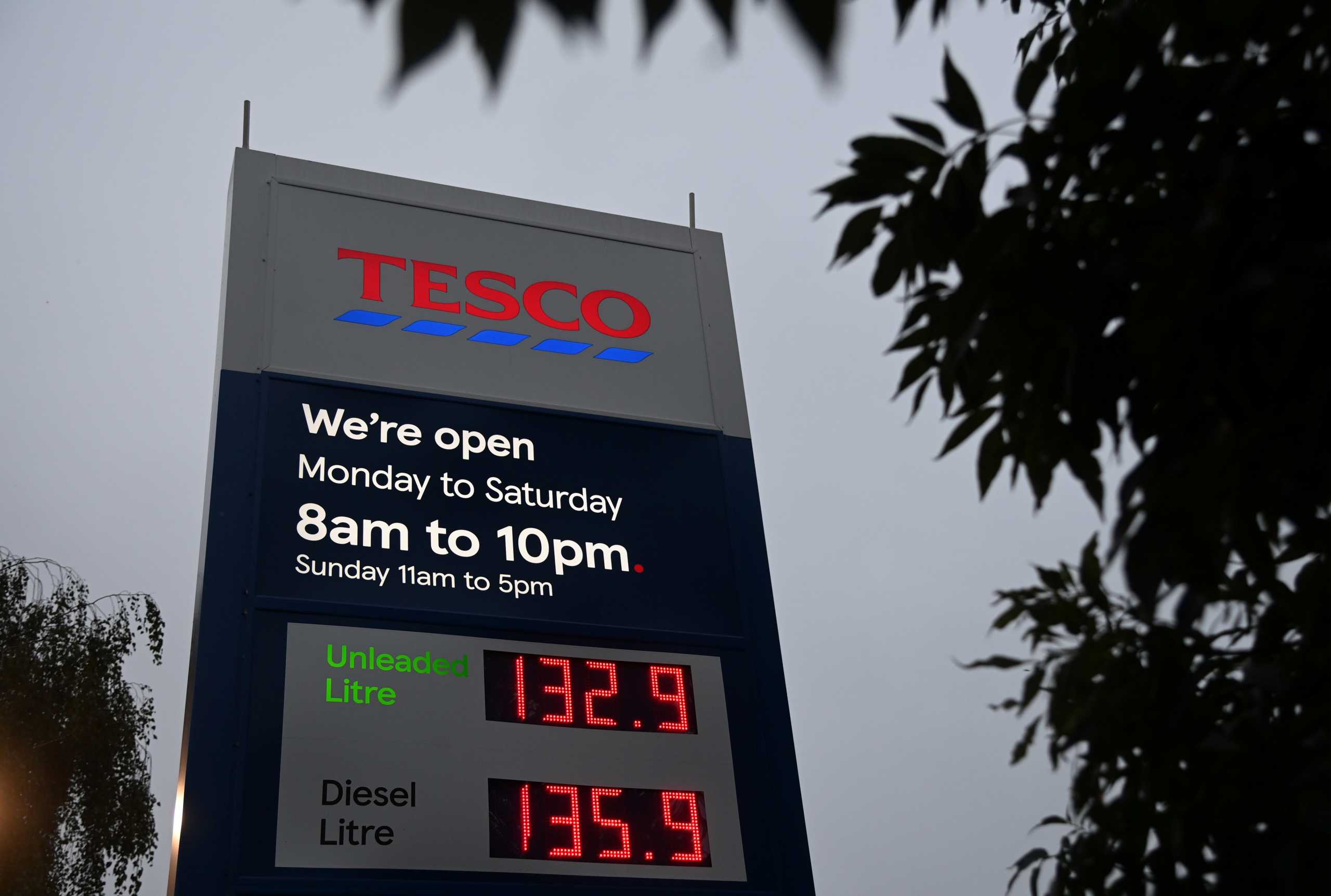 Fuel price signs are seen a Tesco supermarket and petrol station in London, Britain, September 24, 2021. REUTERS