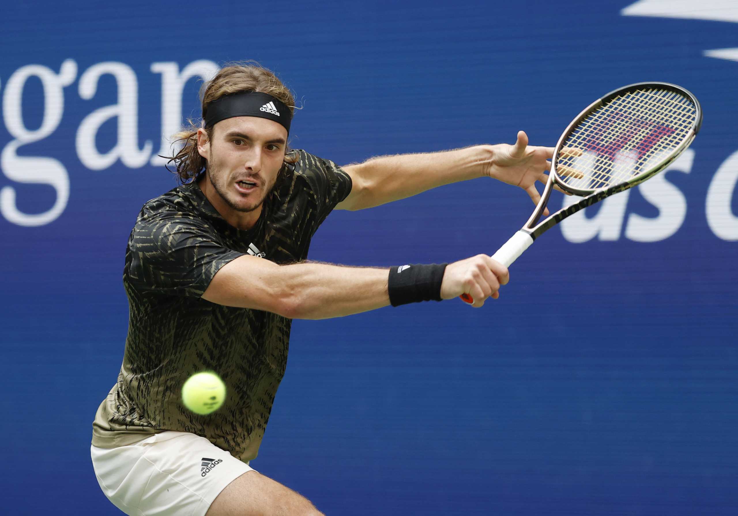 Sep 3, 2021; Flushing, NY, USA;  Stefanos Tsitsipas of Greece hits a shot against Carlos Alcaraz of Spain in a third round match on day five of the 2021 U.S. Open tennis tournament at USTA Billie Jean King National Tennis Center. Mandatory Credit: Jerry Lai-USA TODAY Sports