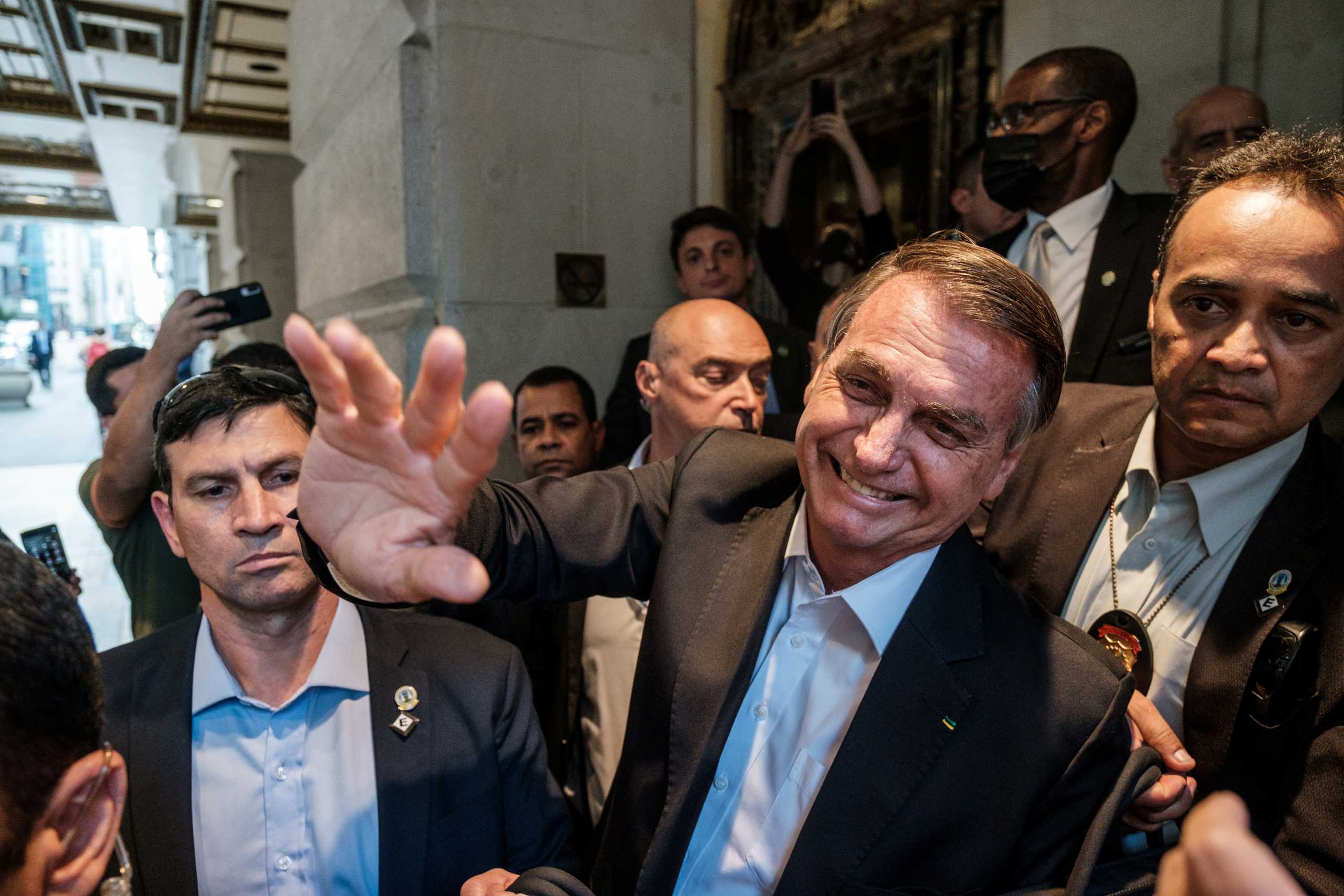Brazil's President Jair Bolsonaro greets supporters outside his hotel during the 76th Session of the U.N. General Assembly in New York, U.S., September 21, 2021.  REUTERS