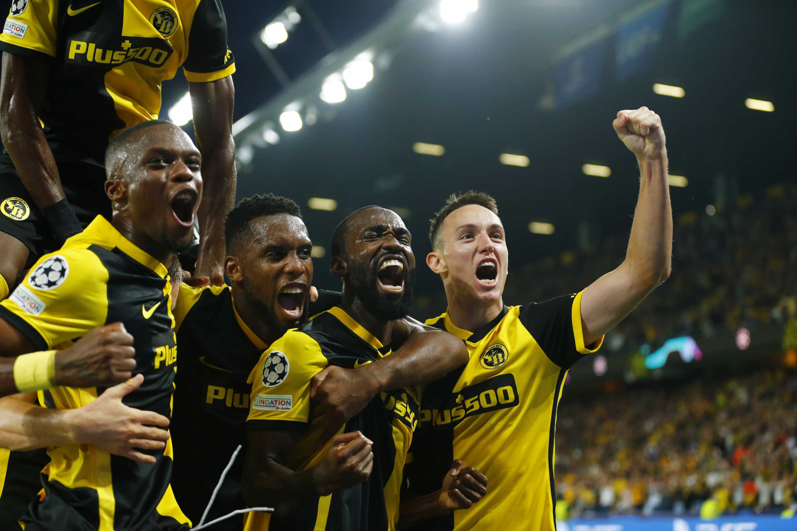 Soccer Football - Champions League - Group F - BSC Young Boys v Manchester United - Stadion Wankdorf, Bern, Switzerland- September 14, 2021 BSC Young Boys' Moumi Ngamaleu celebrates scoring their first goal with teammates REUTERS