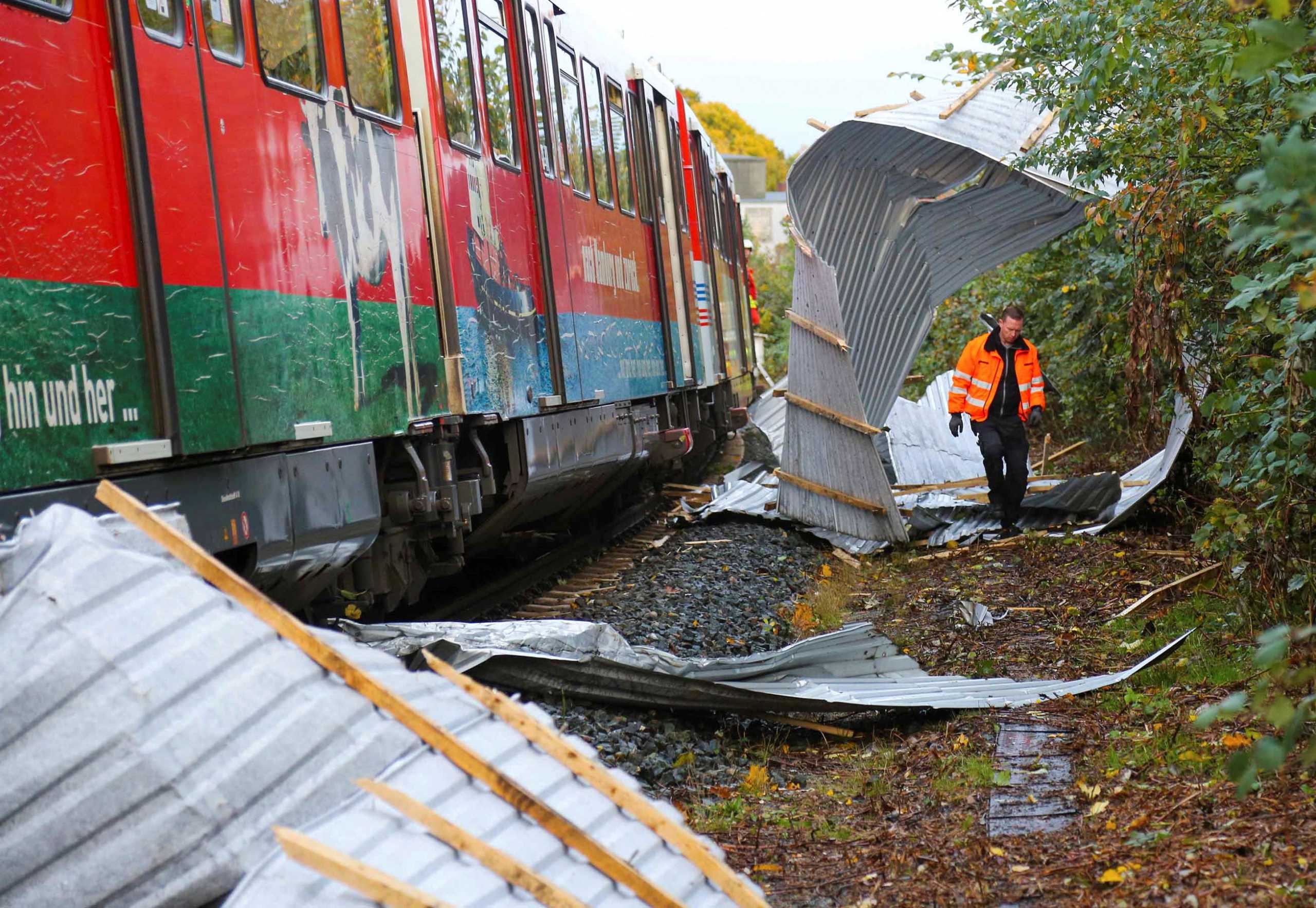A regional train is pictured after it had to make an emergency stop due to corrugated metal panels from a nearby roof amid strong winds, in Neumuenster, northern Germany, October 21, 2021. REUTERS