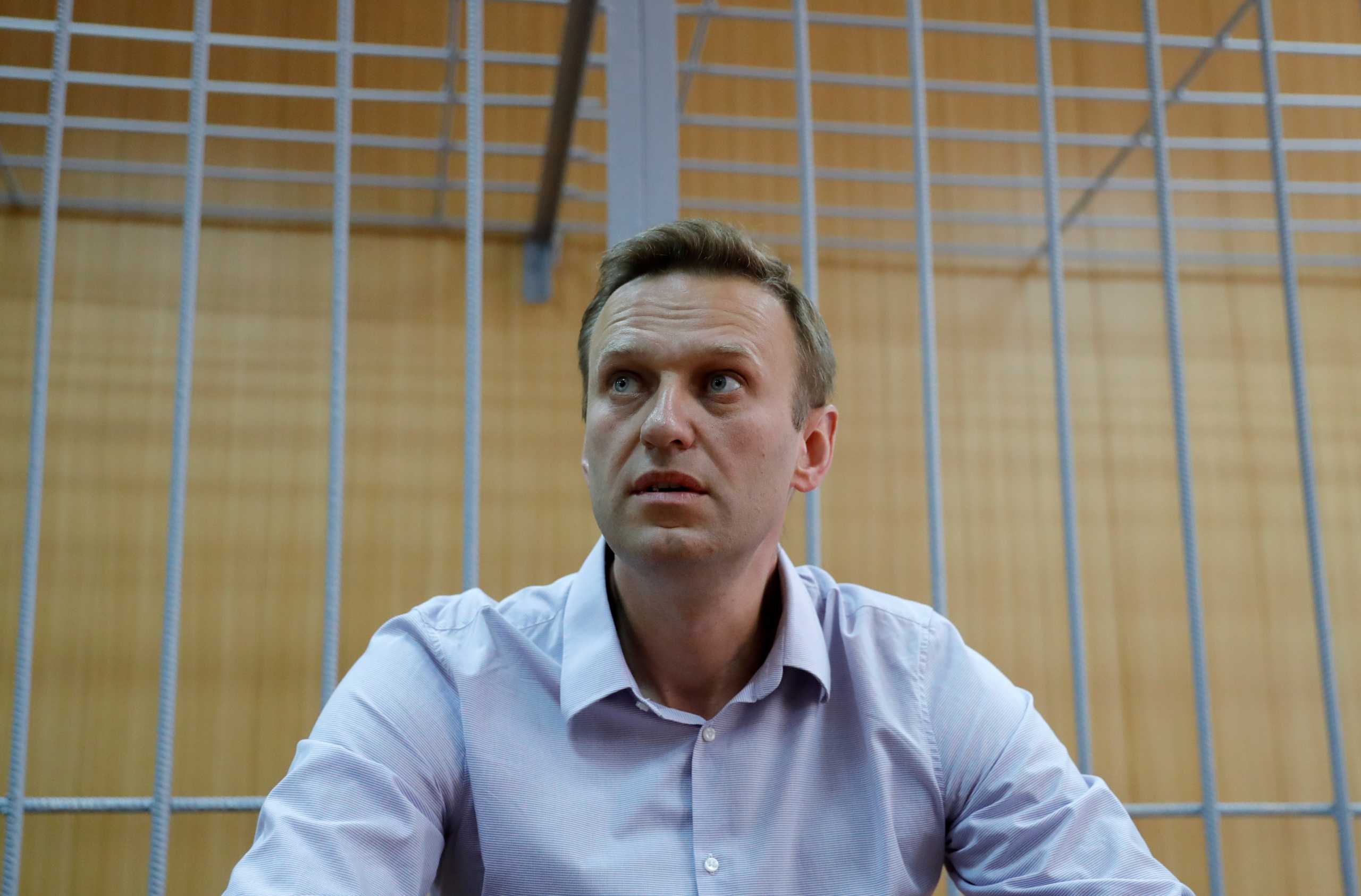 FILE PHOTO: Russian opposition leader Alexei Navalny, who was detained at a recent protest called under the slogan "Putin is not our tsar", attends a court hearing in Moscow, Russia May 15, 2018. REUTERS