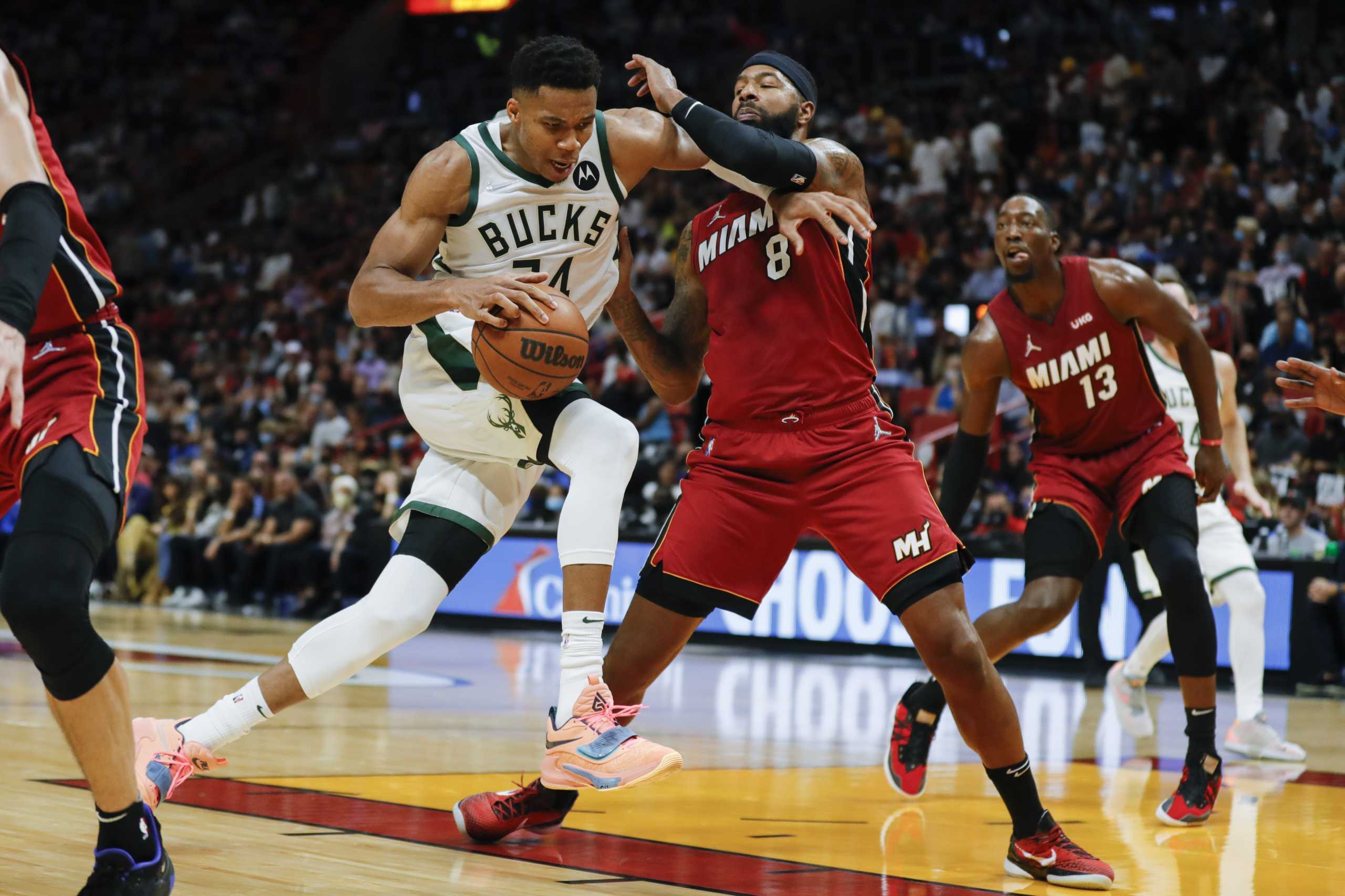 Oct 21, 2021; Miami, Florida, USA; Milwaukee Bucks forward Giannis Antetokounmpo (34) dribbles the ball around Miami Heat forward Markieff Morris (8) during the second quarter of the game at FTX Arena. Mandatory Credit: Sam Navarro-USA TODAY Sports