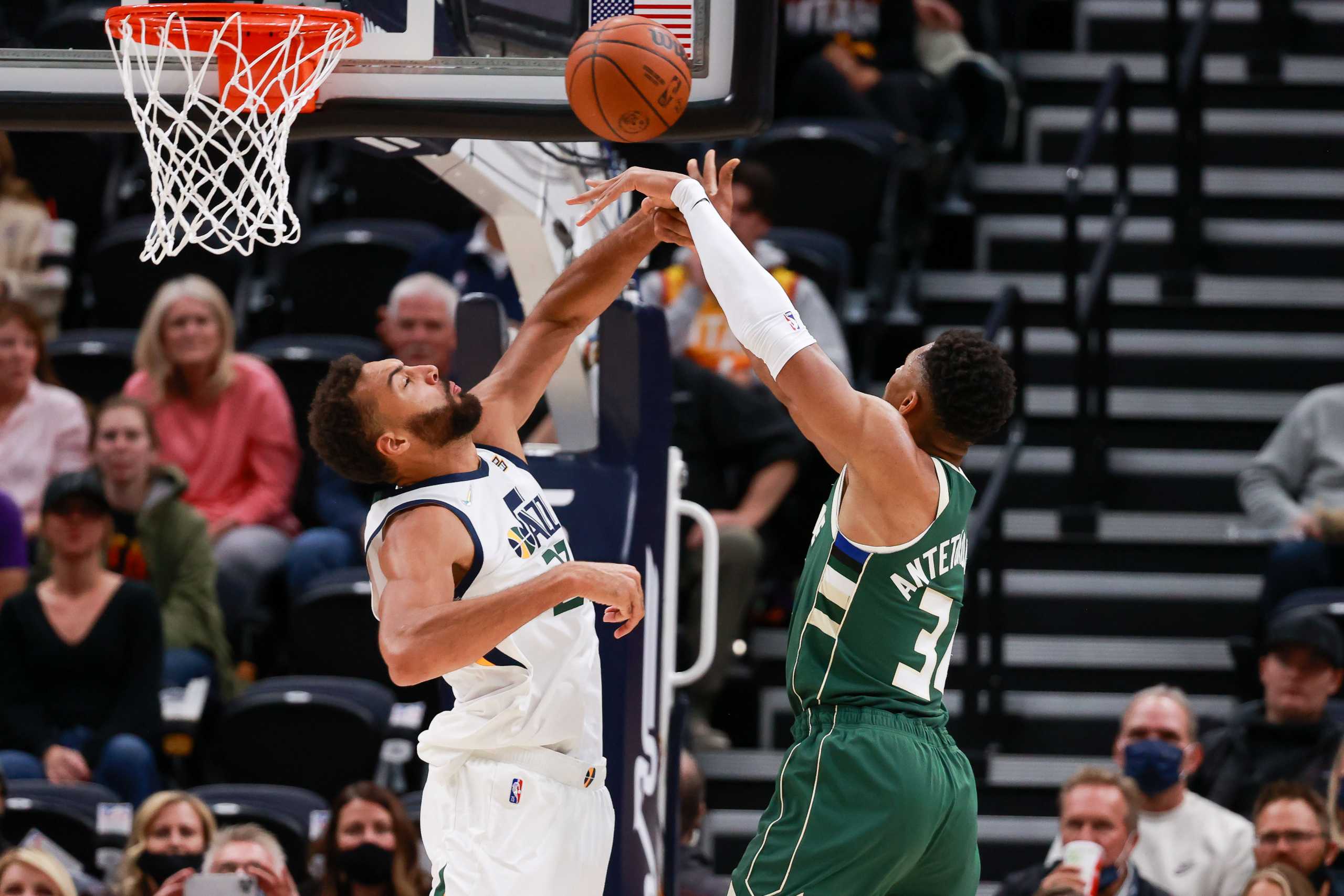 Oct 13, 2021; Salt Lake City, Utah, USA;  Milwaukee Bucks forward Giannis Antetokounmpo (34) is fouled by Utah Jazz center Rudy Gobert (27) while shooting the ball during the first quarter at Vivint Arena. Mandatory Credit: Chris Nicoll-USA TODAY Sports