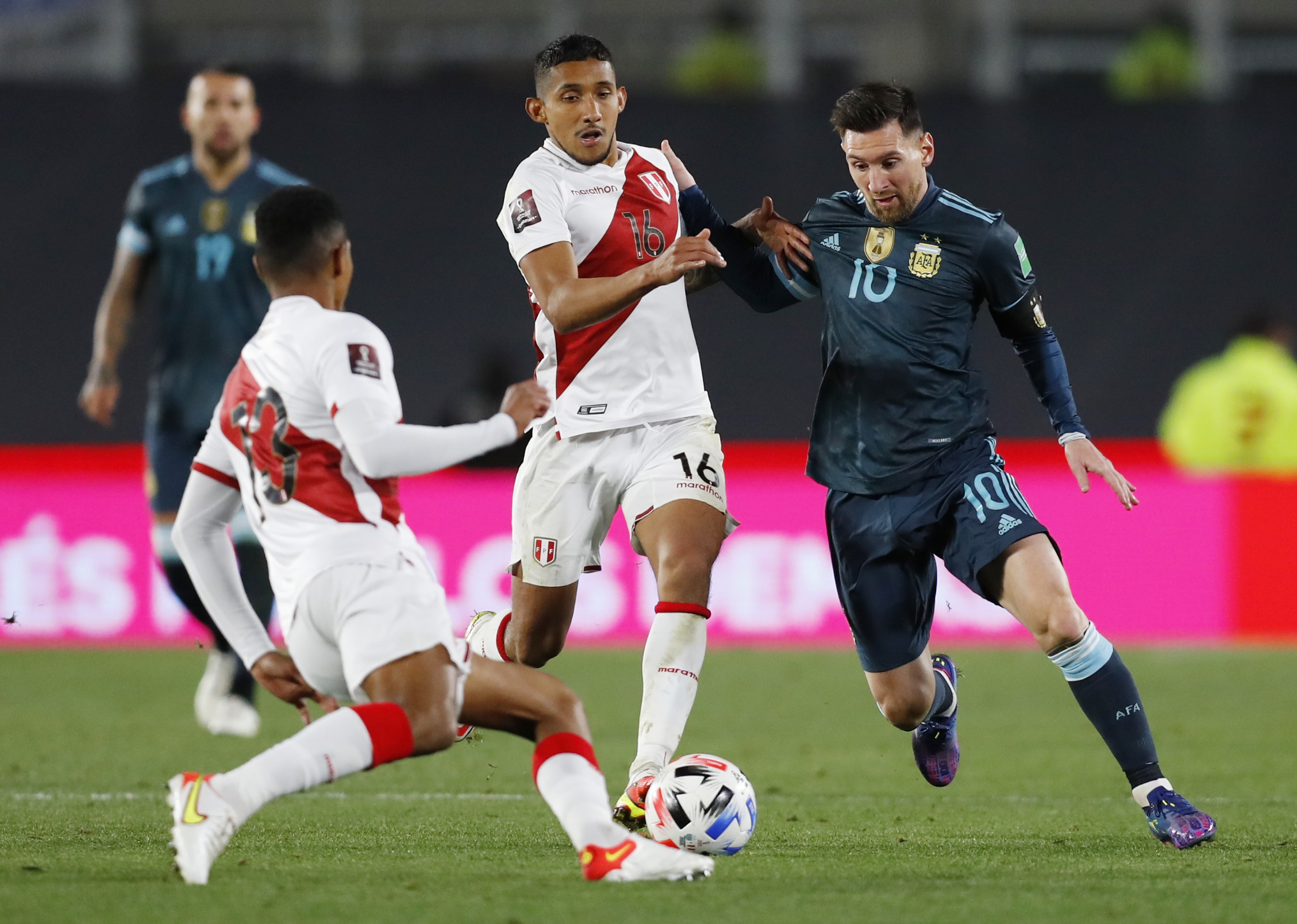Soccer Football - World Cup - South American Qualifiers - Argentina v Peru -  Estadio Monumental, Buenos Aires, Argentina - October 14, 2021 Argentina's Lionel Messi in action with Peru's Christofer Gonzales REUTERS