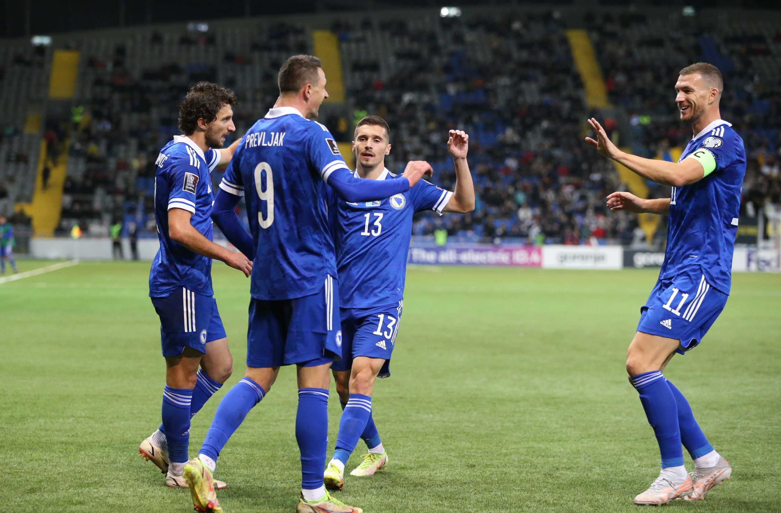 Soccer Football - World Cup - UEFA Qualifiers - Group D - Kazakhstan v Bosnia and Herzegovina - Astana Arena, Astana, Kazakhstan - October 9, 2021  Bosnia and Herzegovina's Smail Prevljak celebrates scoring their first goal with Gojko Cimirot and Edin Dzeko REUTERS