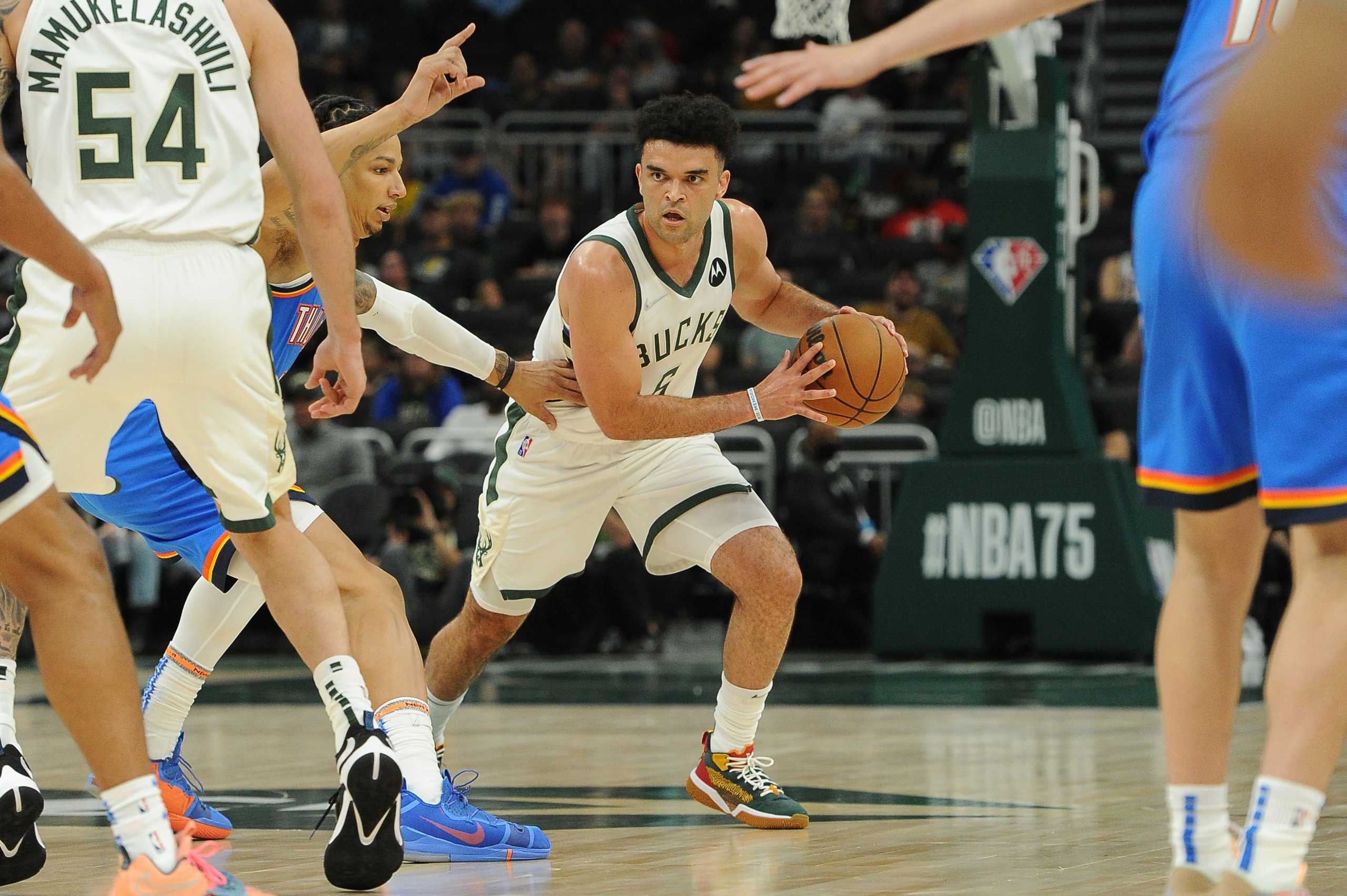 Oct 10, 2021; Milwaukee, Wisconsin, USA;  Milwaukee Bucks guard Elijah Bryant (6) drives to the basket against Oklahoma City Thunder forward DJ Wilson at Fiserv Forum. Mandatory Credit: Michael McLoone-USA TODAY Sports