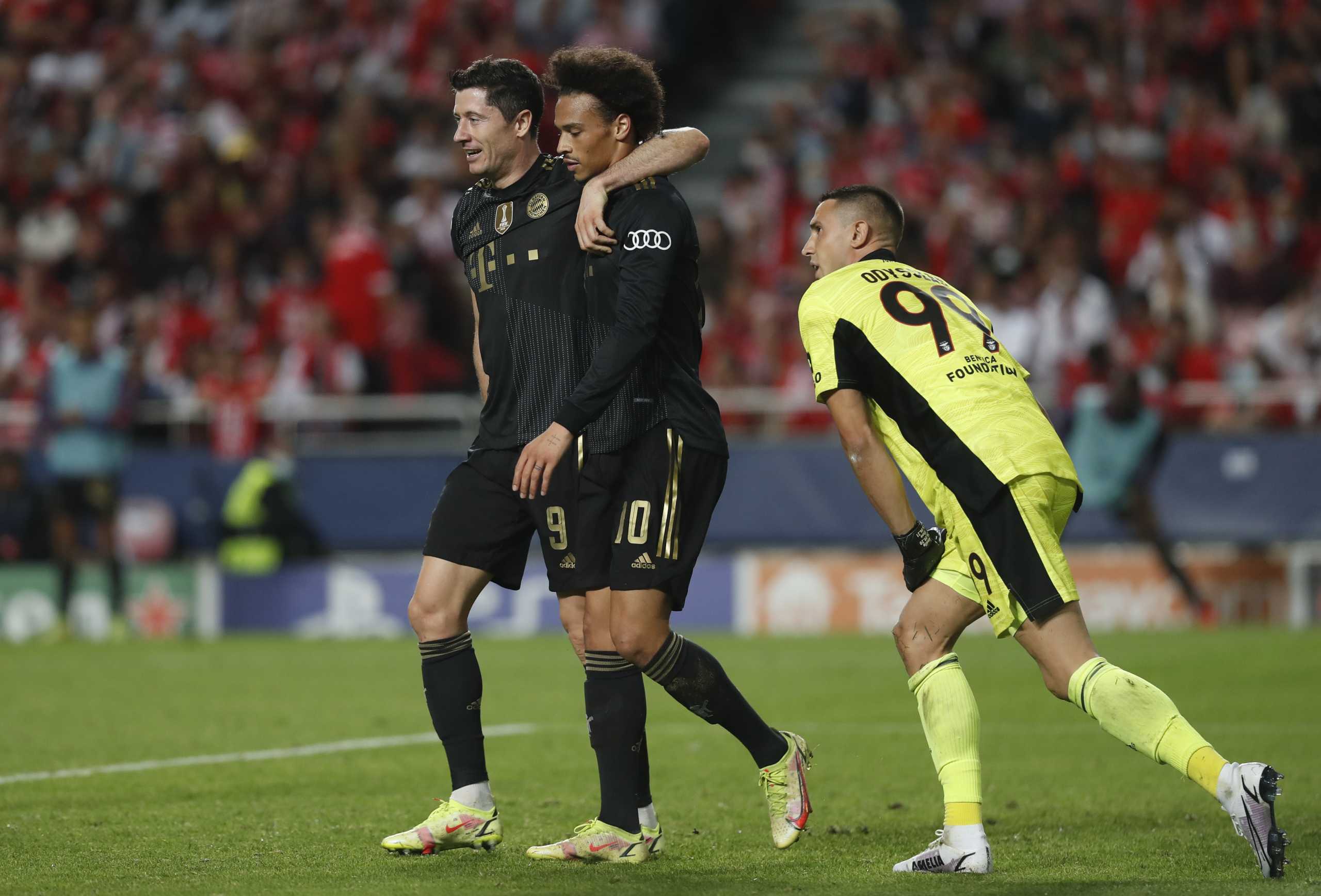 Soccer Football - Champions League - Group E - Benfica v Bayern Munich - Estadio da Luz, Lisbon, Portugal - October 20, 2021  Bayern Munich's Robert Lewandowski celebrates scoring their third goal with Leroy Sane REUTERS