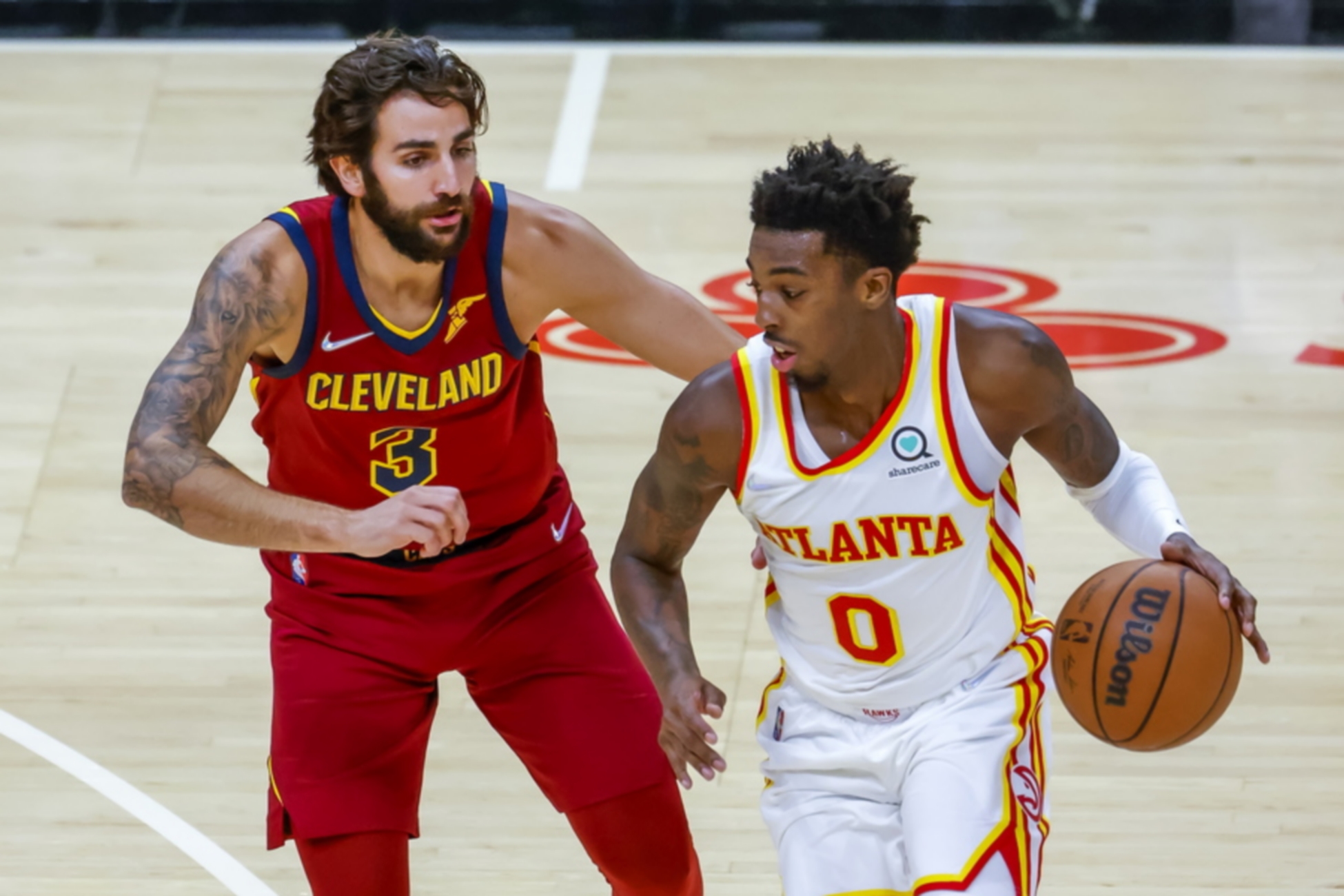 epa09510066 Cleveland Cavaliers guard Ricky Rubio (L) of Spain in action against Atlanta Hawks guard Brandon Goodwin (R) during the first half of the NBA preseason basketball game between the Cleveland Cavaliers and the Atlanta Hawks at State Farm Arena in Atlanta, Georgia, USA, 06 October 2021.  EPA