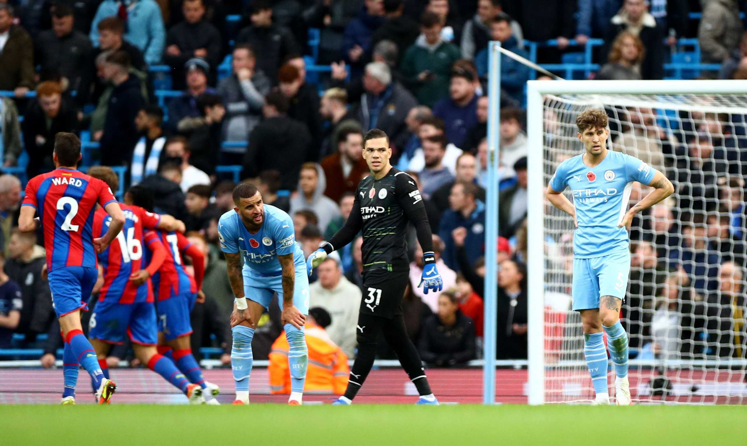 Soccer Football - Premier League - Manchester City v Crystal Palace - Etihad Stadium, Manchester, Britain - October 30, 2021 Manchester City's Kyle Walker looks dejected with Ederson and John Stones after Crystal Palace's second goal scored by Conor Gallagher REUTERS