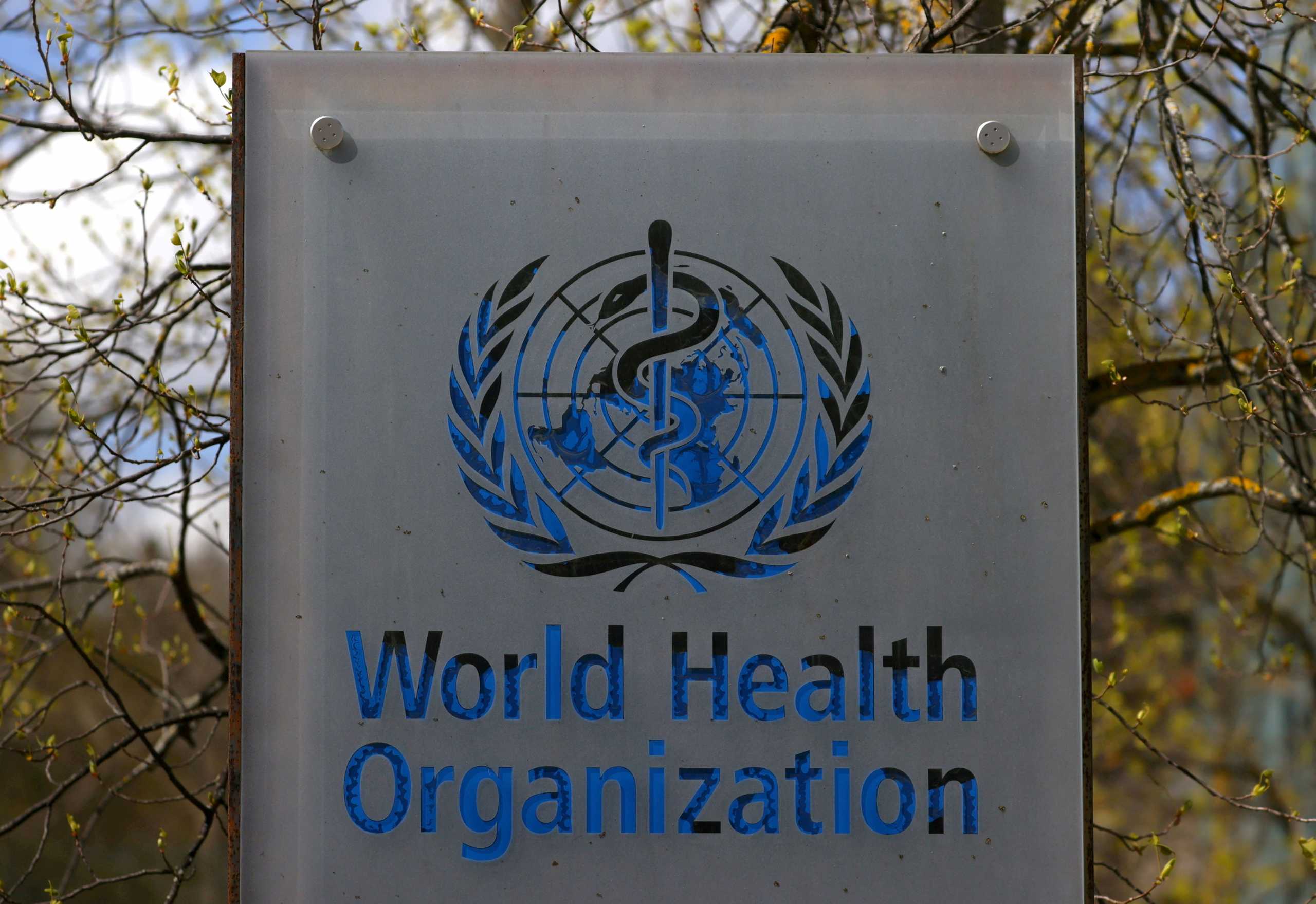 FILE PHOTO: A logo is pictured outside a building of the World Health Organization (WHO) during an executive board meeting on update on the coronavirus disease (COVID-19) outbreak, in Geneva, Switzerland, April 6, 2021. REUTERS
