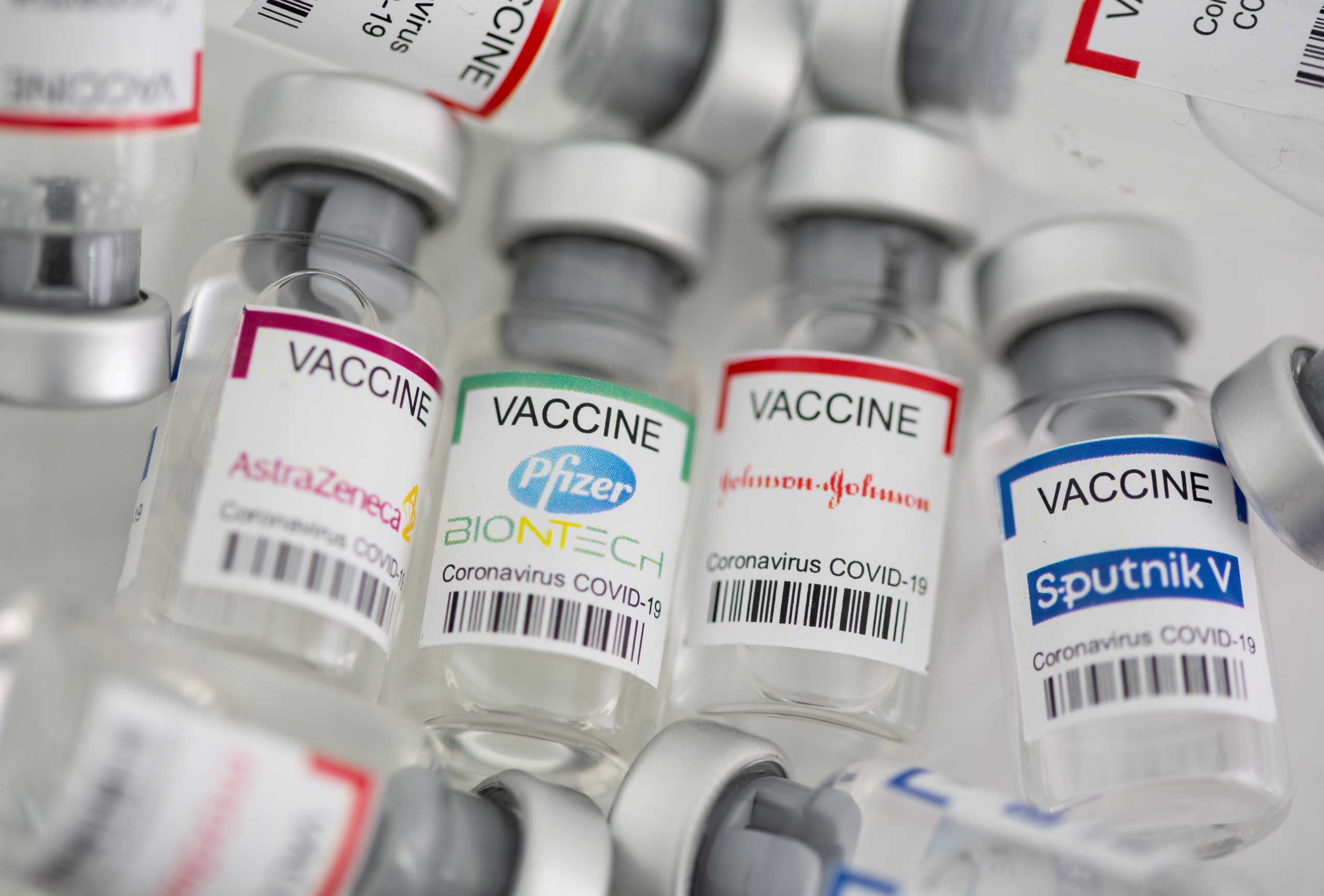 FILE PHOTO: Vials labelled "AstraZeneca, Pfizer - Biontech, Johnson&Johnson, Sputnik V coronavirus disease (COVID-19) vaccine" are seen in this illustration picture taken May 2, 2021. REUTERS