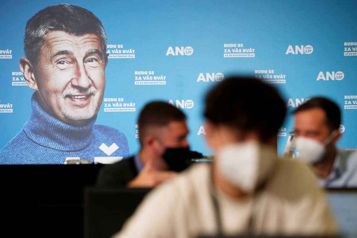 A billboard of Czech Prime Minister and leader of ANO party, Andrej Babis, is seen as journalists wait ahead of a news conference in Prague, Czech Republic October 9, 2021. REUTERS