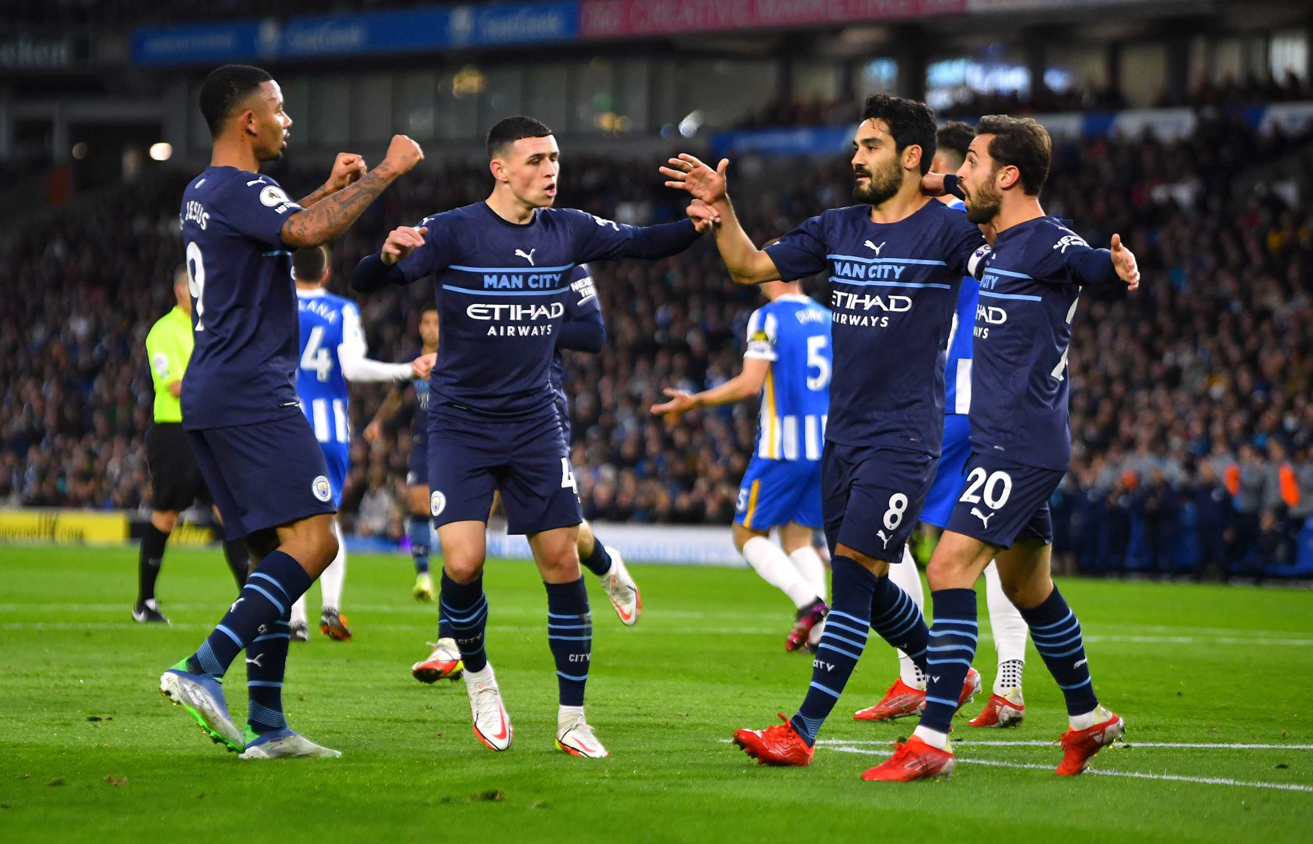 Soccer - England - Premier League - Brighton & Hove Albion v Manchester City - The American Express Community Stadium, Brighton, Britain - October 23, 2021 Manchester City's Ilkay Gundogan celebrates scoring their first goal with teammates REUTERS