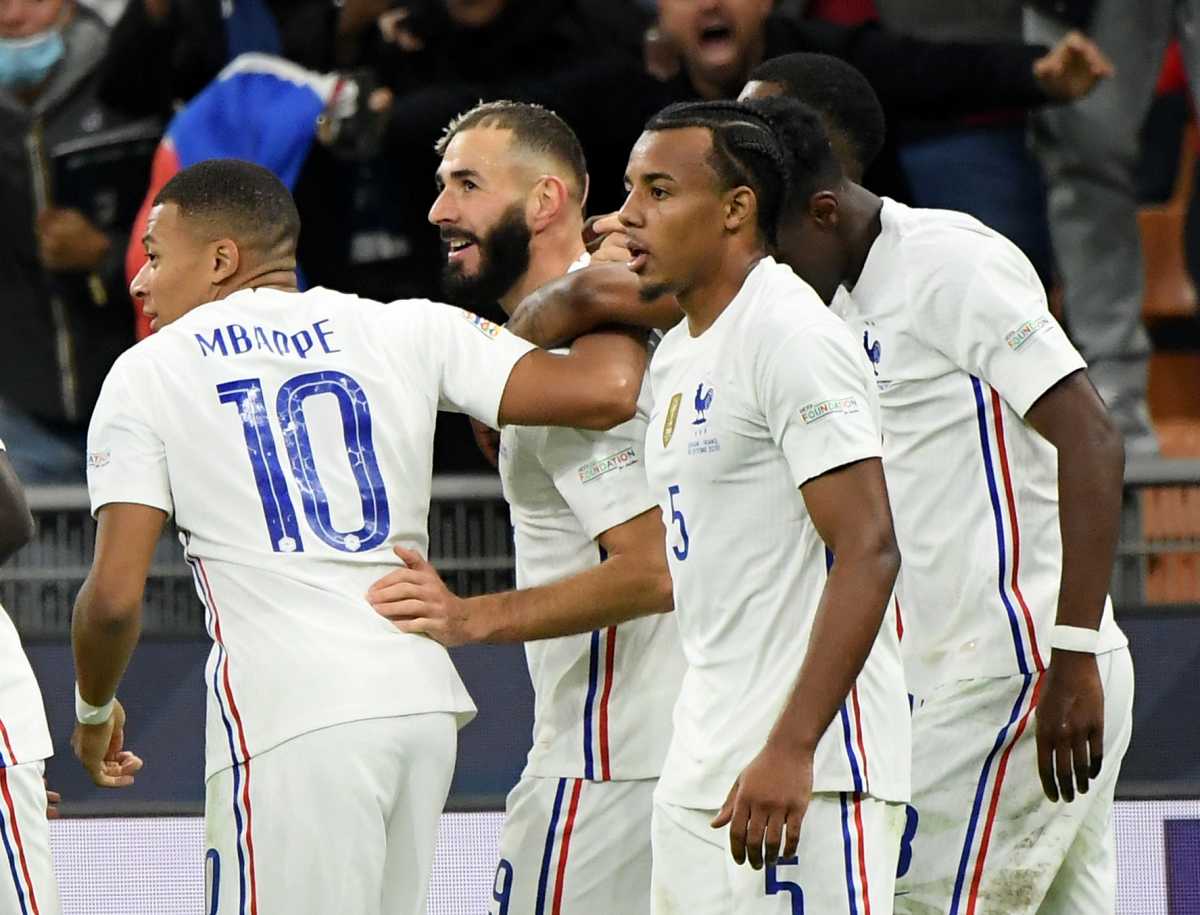 Soccer Football - Nations League - Final - Spain v France - San Siro, Milan, Italy - October 10, 2021 France's Karim Benzema celebrates scoring their first goal with teammates REUTERS