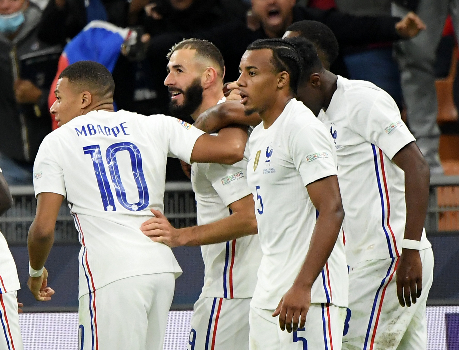 Soccer Football - Nations League - Final - Spain v France - San Siro, Milan, Italy - October 10, 2021 France's Karim Benzema celebrates scoring their first goal with teammates REUTERS