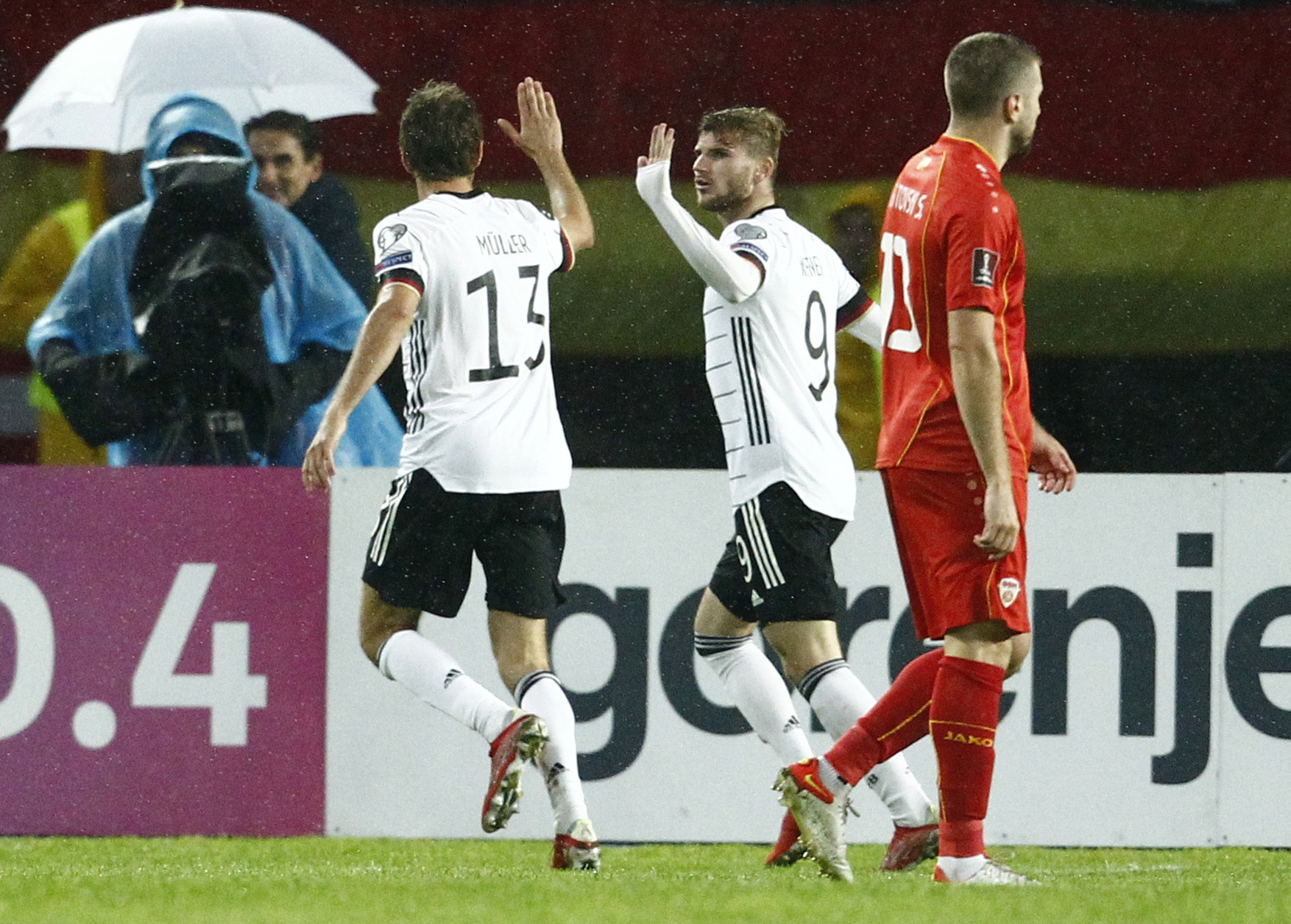 Soccer Football - World Cup - UEFA Qualifiers - Group J - North Macedonia v Germany - Toshe Proeski Arena, Skopje, North Macedonia - October 11, 2021 Germany's Timo Werner and Thomas Muller celebrate their first goal scored by Kai Havertz REUTERS