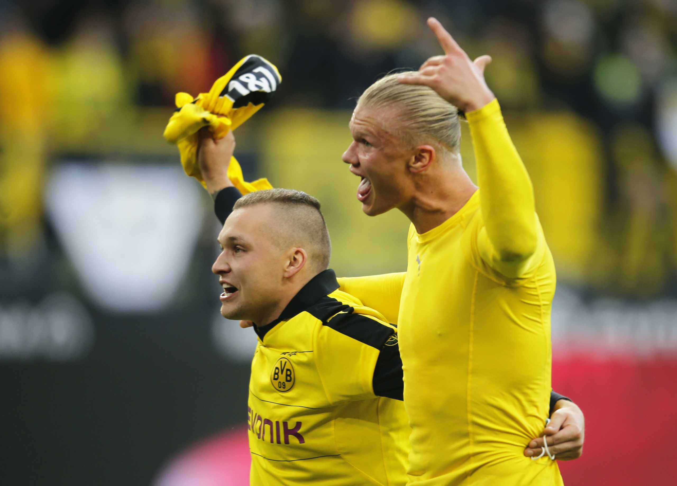 Soccer Football - Bundesliga - Borussia Dortmund v 1. FSV Mainz 05 - Signal Iduna Park, Dortmund, Germany - October 16, 2021  Borussia Dortmund's Erling Braut Haaland celebrates with a fan after the match REUTERS