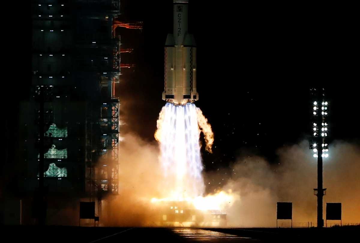 The Long March-2F Y13 rocket, carrying the Shenzhou-13 spacecraft and three astronauts in China's second crewed mission to build its own space station, launches at Jiuquan Satellite Launch Center near Jiuquan, Gansu province, China October 16, 2021. REUTERS