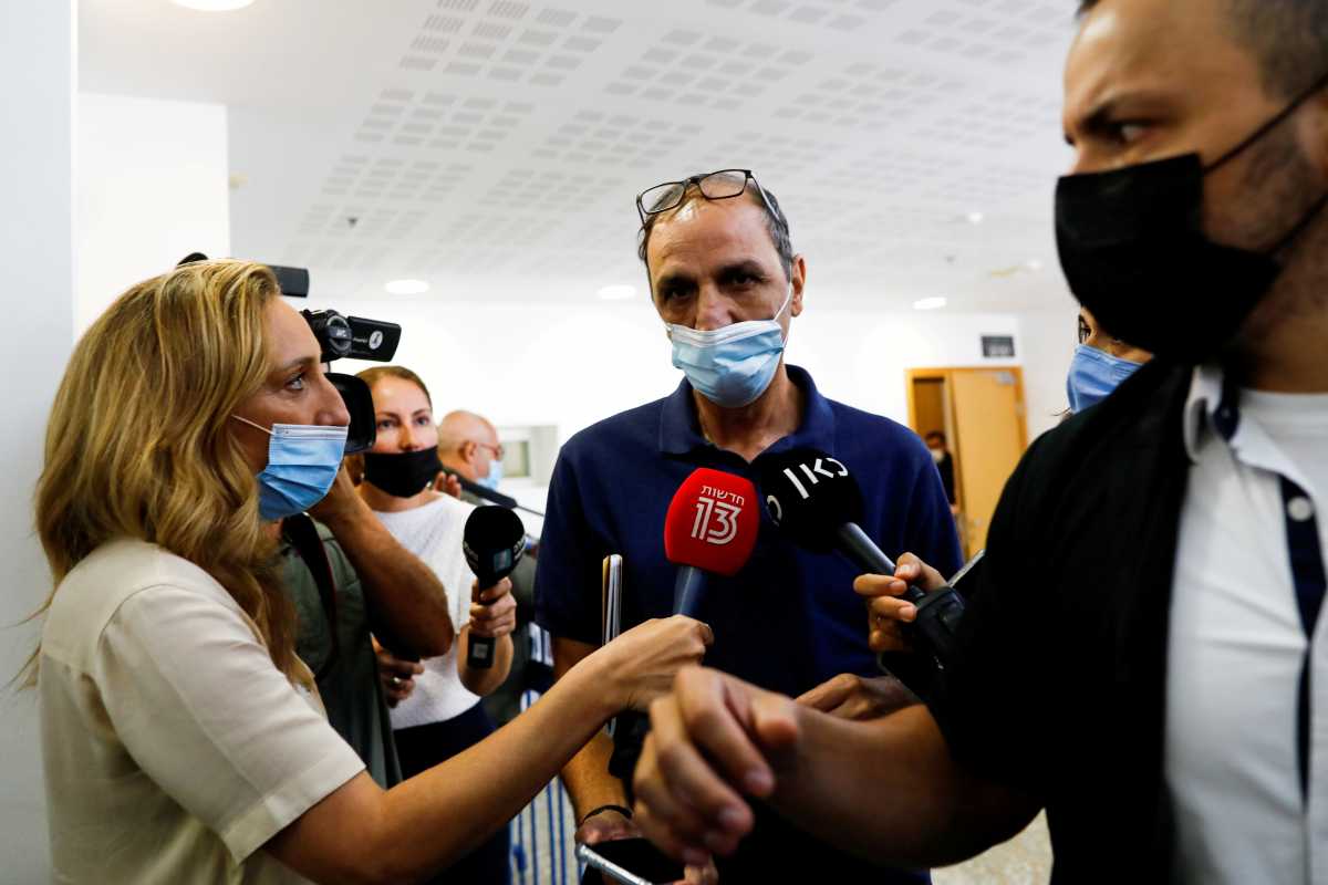 FILE PHOTO: Shmuel Peleg, the grandfather of Eitan Biran, a 6-year-old boy who was the only survivor of an Italian cable car disaster and is now at the centre of a custody battle, declines to speak to members of the media after a court hearing in Tel Aviv, Israel, September 23, 2021. REUTERS