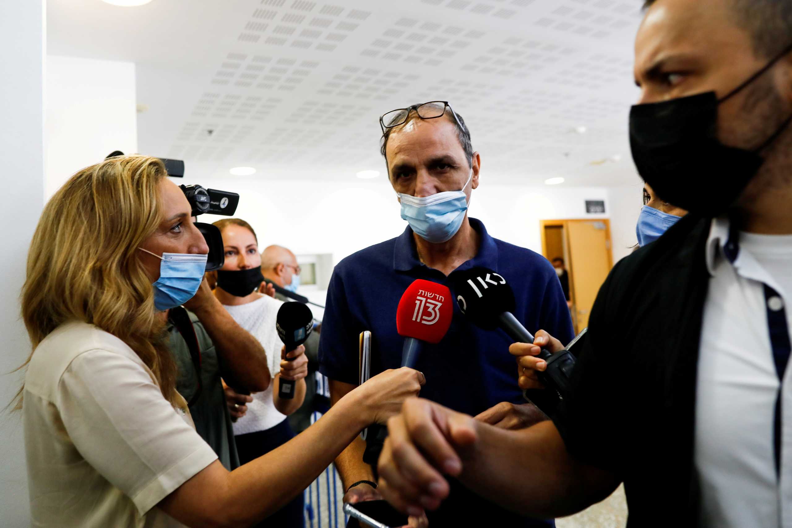 FILE PHOTO: Shmuel Peleg, the grandfather of Eitan Biran, a 6-year-old boy who was the only survivor of an Italian cable car disaster and is now at the centre of a custody battle, declines to speak to members of the media after a court hearing in Tel Aviv, Israel, September 23, 2021. REUTERS