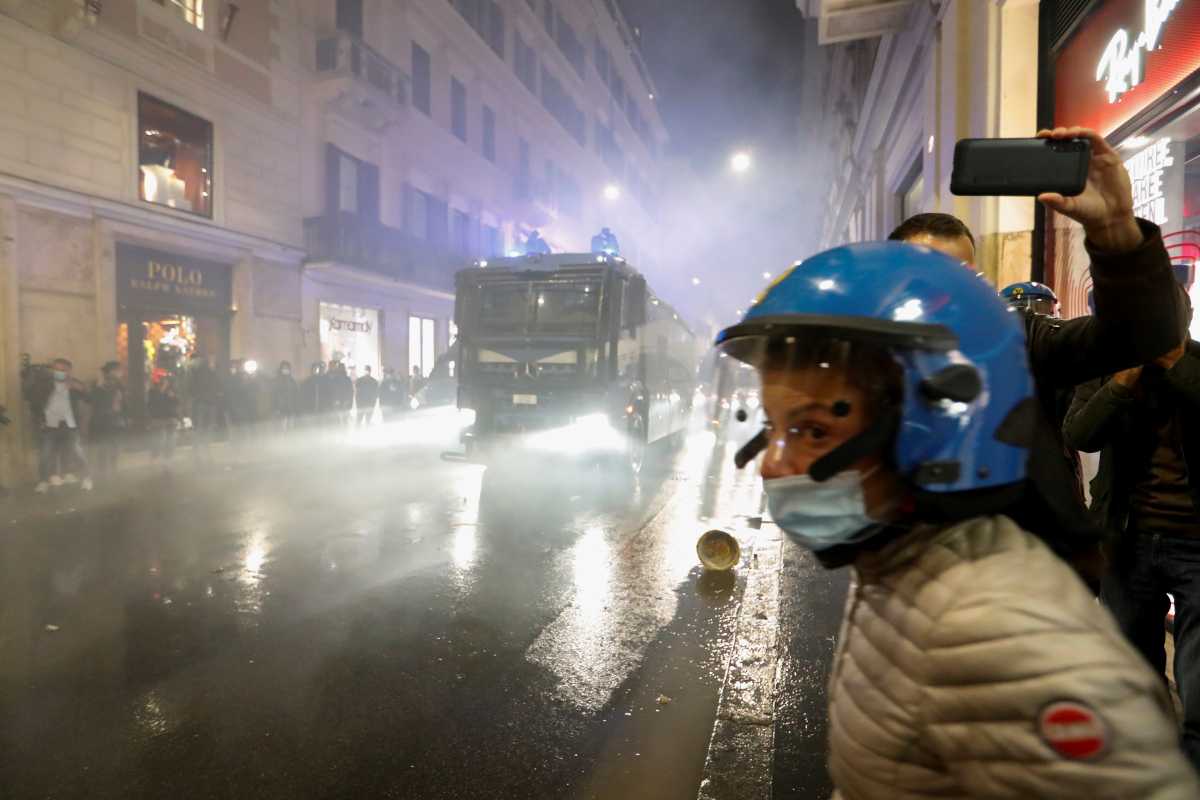 A water cannon drives through Via del Corso, as demonstrators protest against the government's introduction of the "Green Pass", in Rome, Italy, October 9, 2021. REUTERS