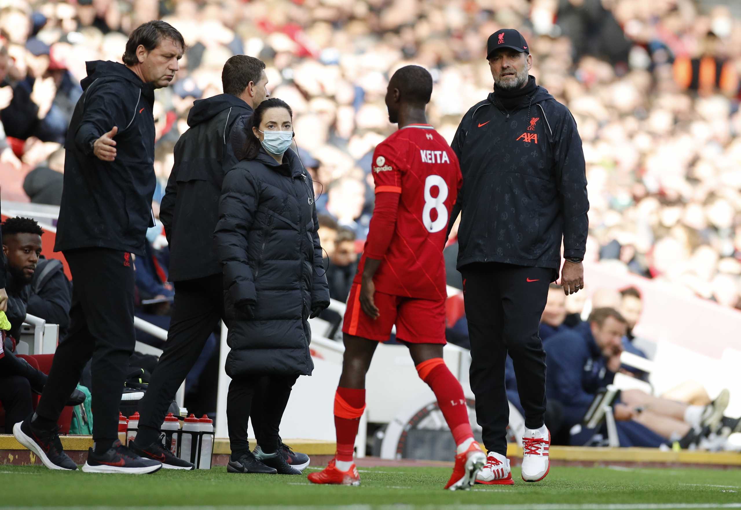 Soccer Football - Premier League - Liverpool v Brighton & Hove Albion - Anfield, Liverpool, Britain - October 30, 2021  Liverpool's Naby Keita is substituted after sustaining an injury as Liverpool manager Juergen Klopp looks on REUTERS
