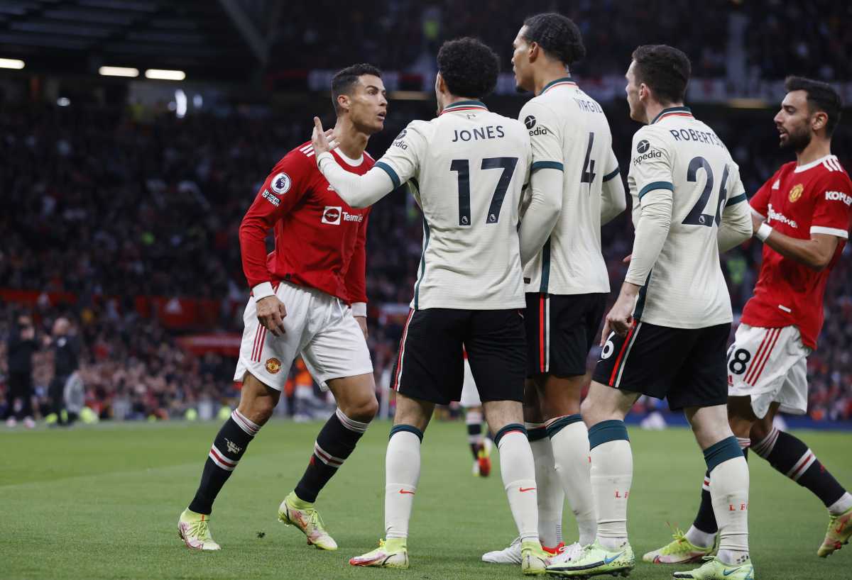 Soccer Football - Premier League - Manchester United v Liverpool - Old Trafford, Manchester, Britain - October 24, 2021 Manchester United's Cristiano Ronaldo clashes with Liverpool's Curtis Jones, Andrew Robertson and Virgil van Dijk REUTERS