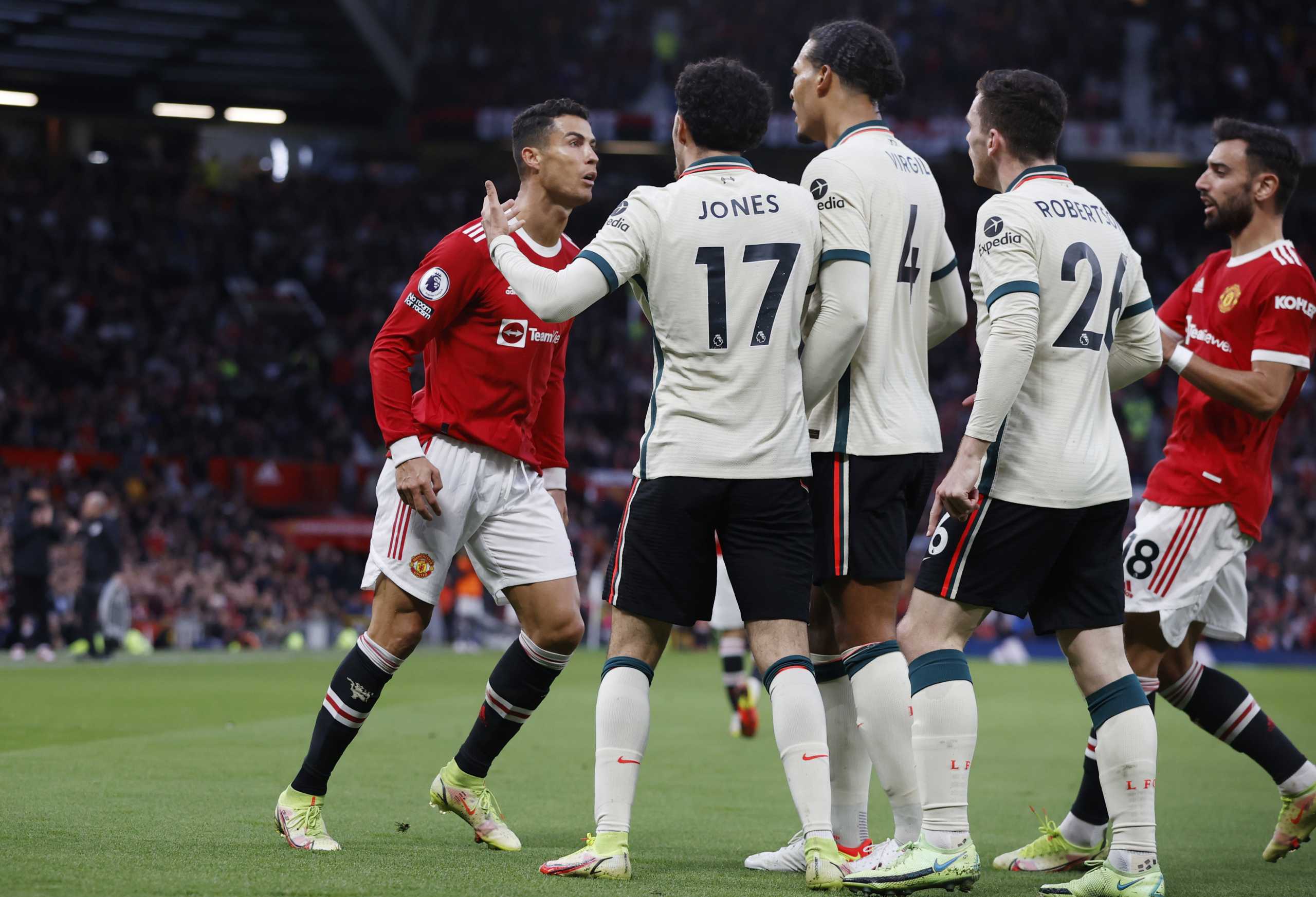 Soccer Football - Premier League - Manchester United v Liverpool - Old Trafford, Manchester, Britain - October 24, 2021 Manchester United's Cristiano Ronaldo clashes with Liverpool's Curtis Jones, Andrew Robertson and Virgil van Dijk REUTERS