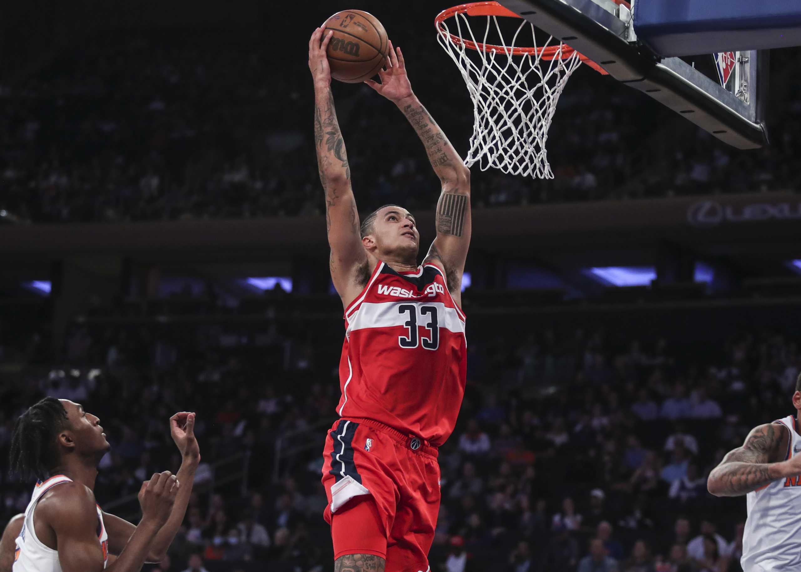 Oct 15, 2021; New York, New York, USA;  Washington Wizards forward Kyle Kuzma (33) goes up for a dunk in the second quarter against the New York Knicks at Madison Square Garden. Mandatory Credit: Wendell Cruz-USA TODAY Sports