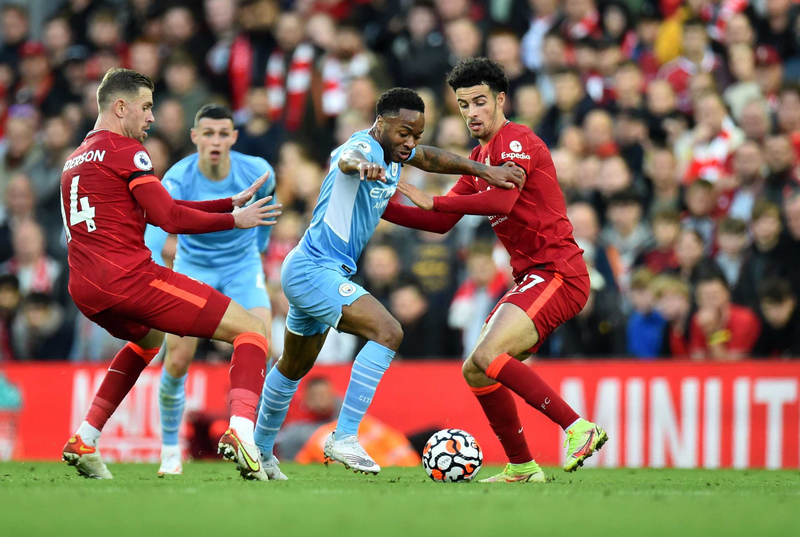 Soccer Football - Premier League - Liverpool v Manchester City - Anfield, Liverpool, Britain - October 3, 2021 Manchester City's Raheem Sterling in action with Liverpool's Curtis Jones and Jordan Henderson REUTERS