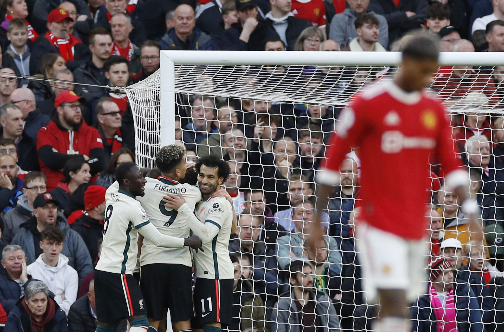 Soccer Football - Premier League - Manchester United v Liverpool - Old Trafford, Manchester, Britain - October 24, 2021 Liverpool's Diogo Jota celebrates scoring their second goal with teammates REUTERS