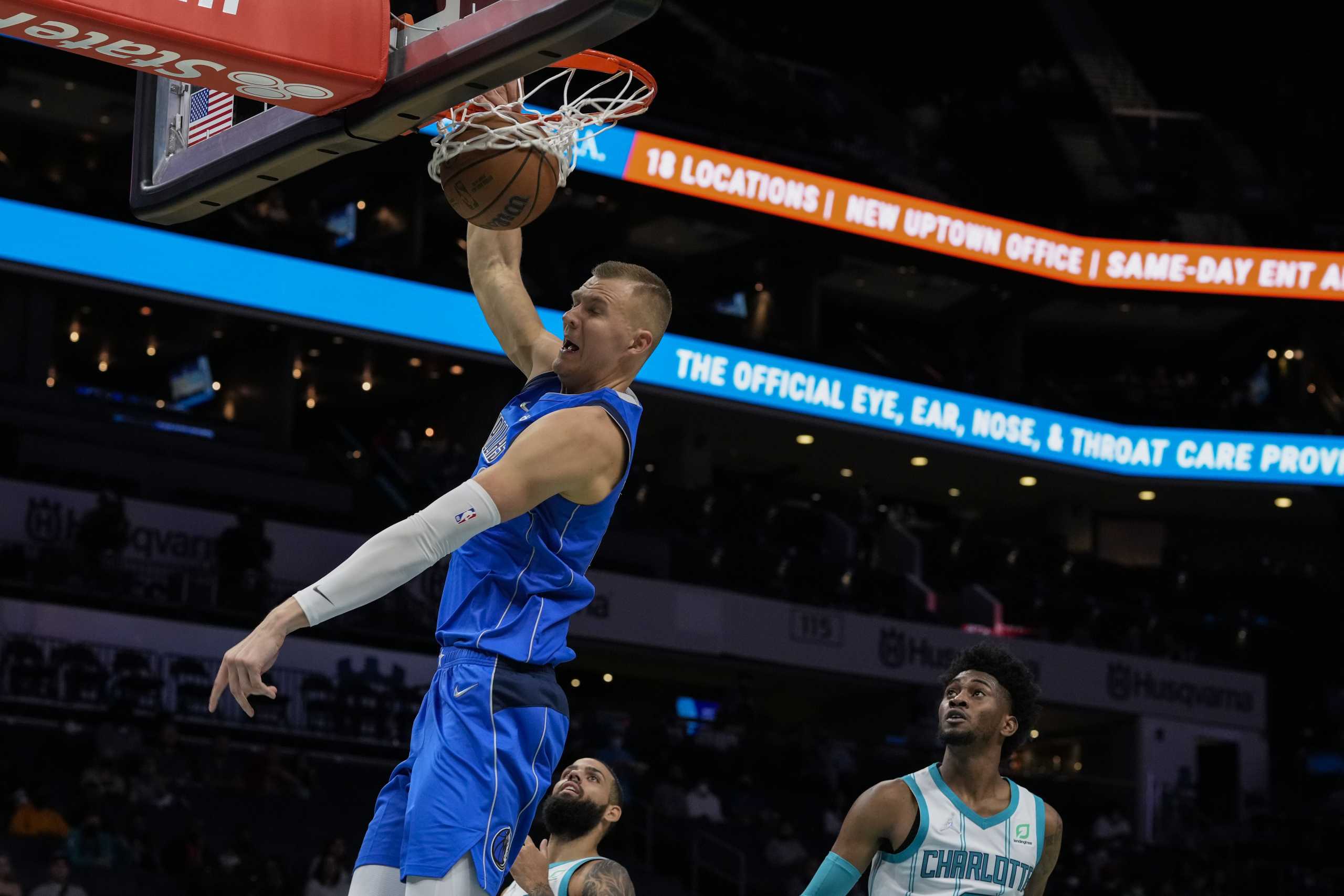 Oct 13, 2021; Charlotte, North Carolina, USA;   Dallas Mavericks center Kristaps Porzingis (6) goes up for a dunk against the Charlotte Hornets during the first half at Spectrum Center. Mandatory Credit: Jim Dedmon-USA TODAY Sports