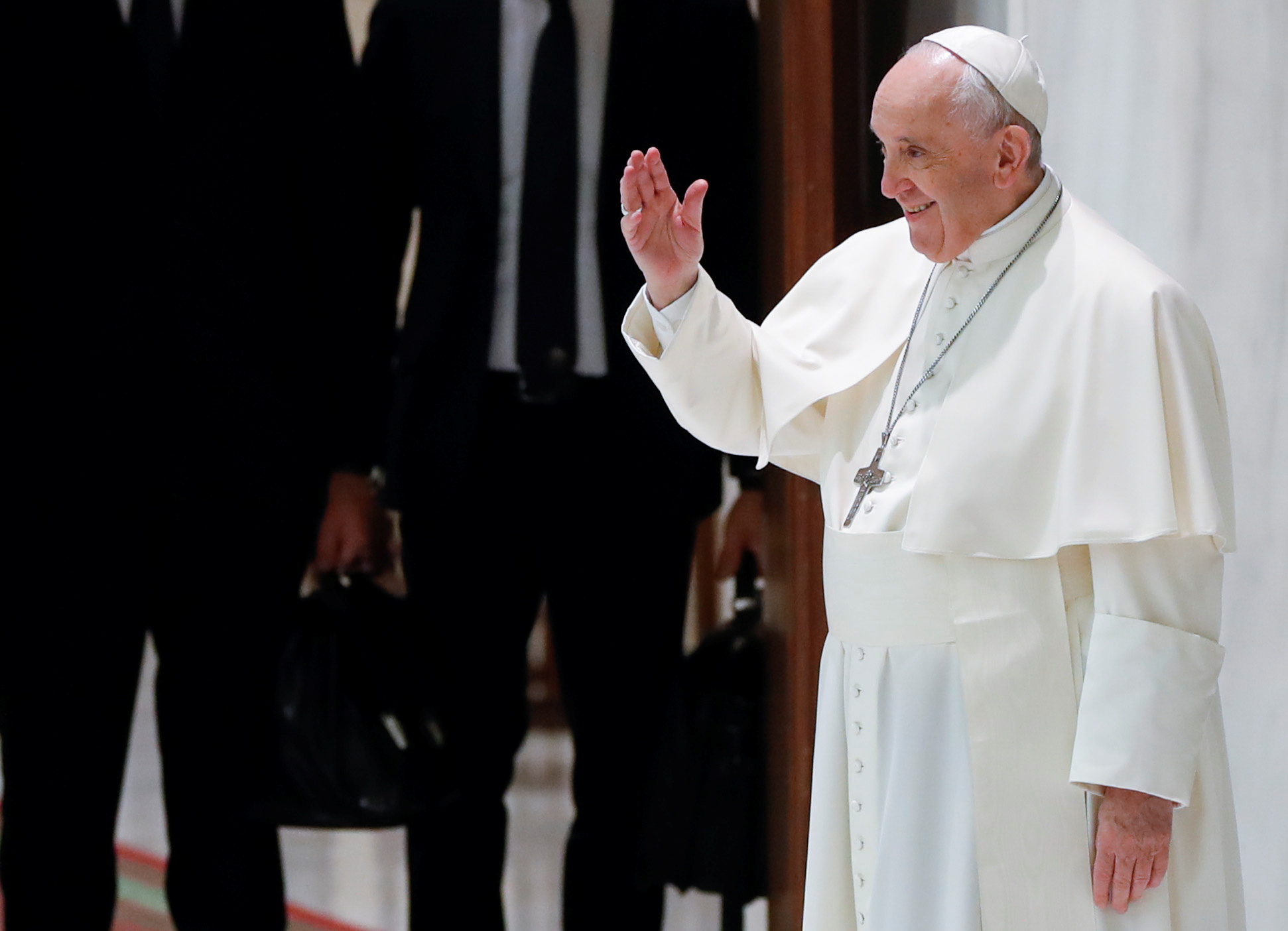 Pope Francis greets people as he arrives for the weekly general audience at the Vatican, October 20, 2021. REUTERS