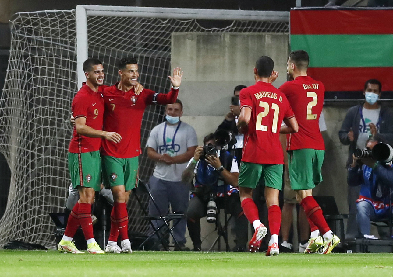 Soccer Football - International Friendly - Portugal v Qatar - Estadio Algarve, Almancil, Portugal - October 9, 2021 Portugal's Cristiano Ronaldo celebrates scoring their first goal with teammates REUTERS