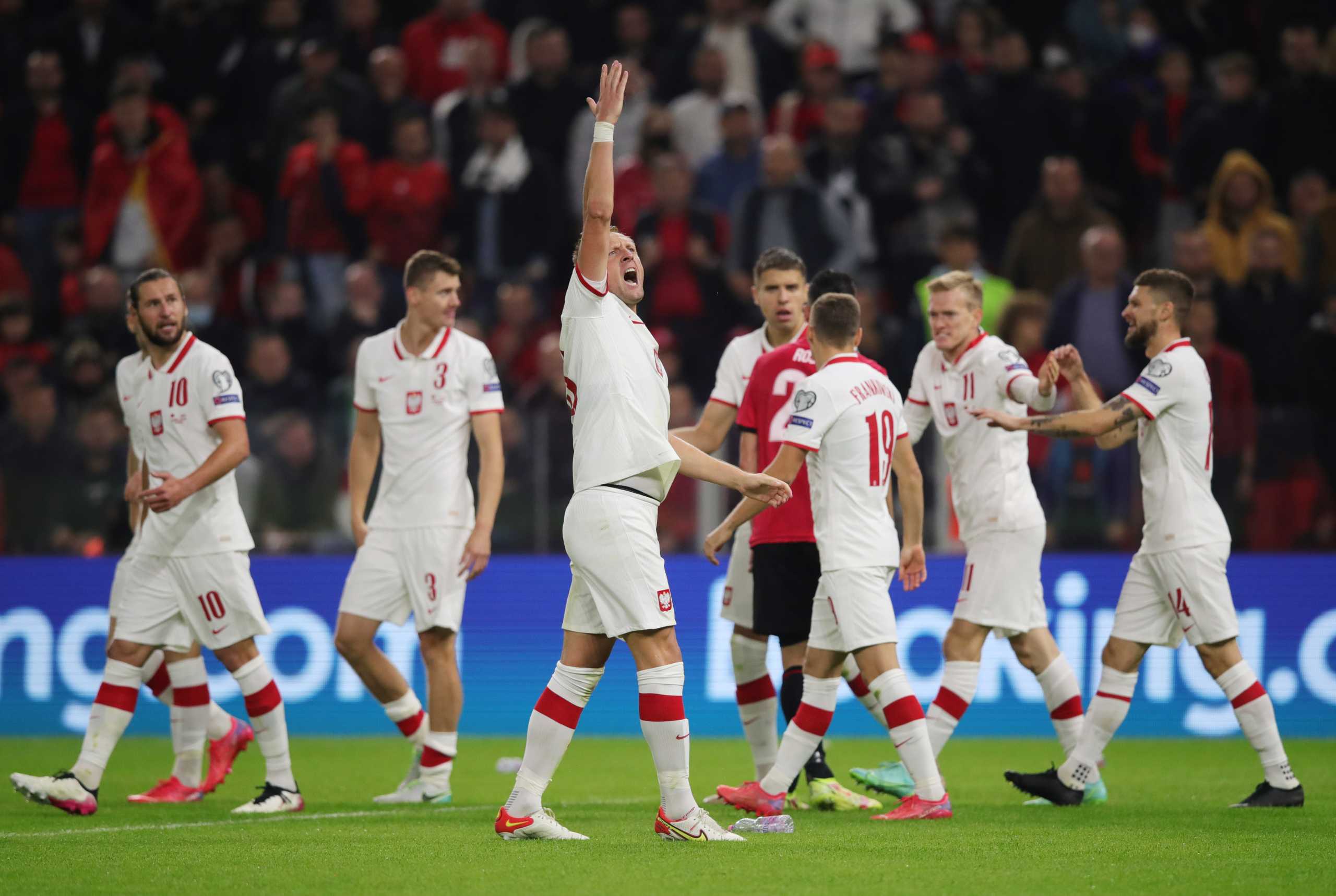 Soccer Football - World Cup - UEFA Qualifiers - Group I - Albania v Poland - Arena Kombetare, Tirana, Albania - October 12, 2021 Poland's Karol Swiderski celebrates scoring their first goal with teammates REUTERS