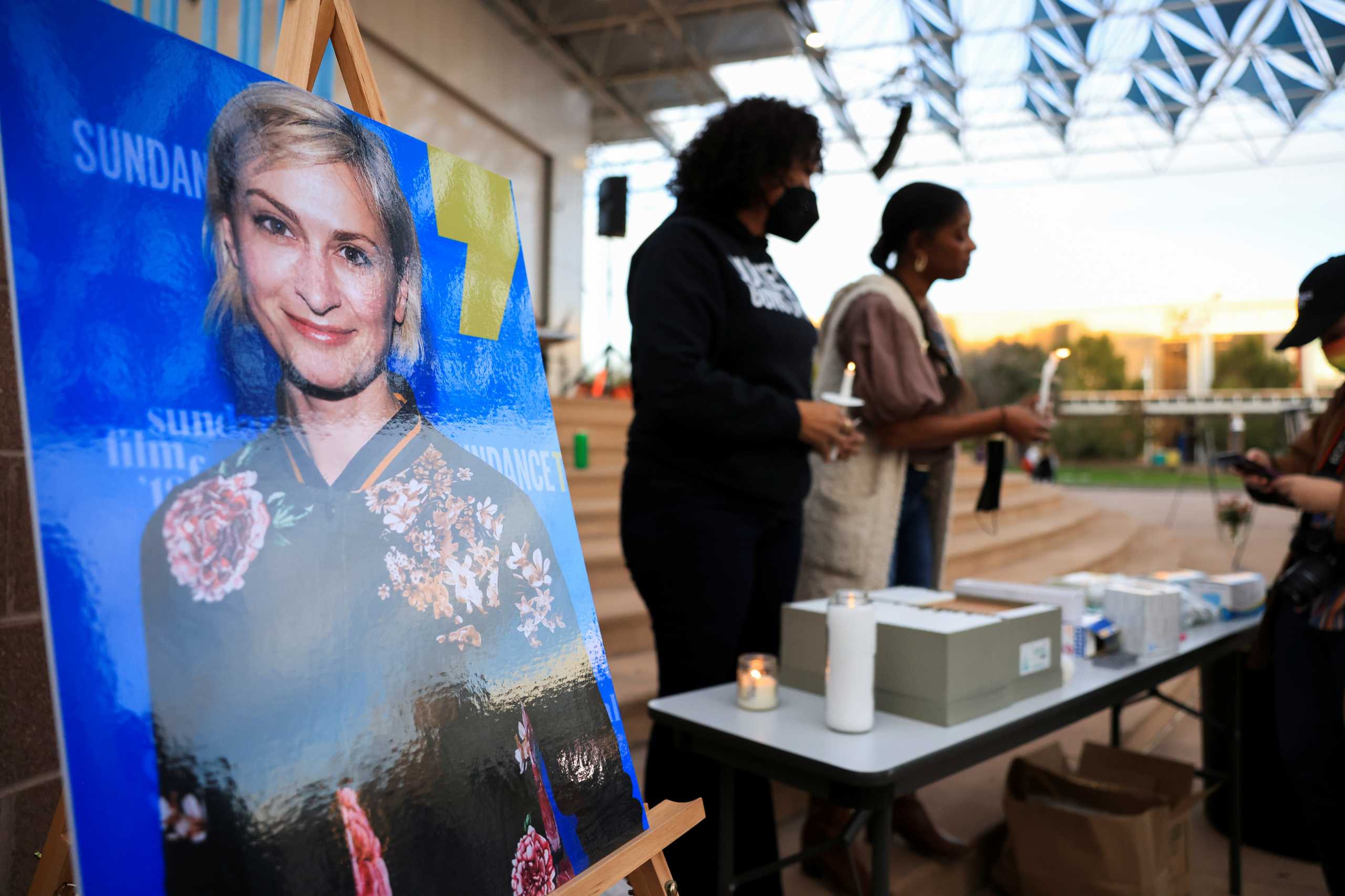 An image of cinematographer Halyna Hutchins, who died after being shot by Alec Baldwin on the set of his movie "Rust", is displayed at a vigil in her honour in Albuquerque, New Mexico, U.S., October 23, 2021.  REUTERS