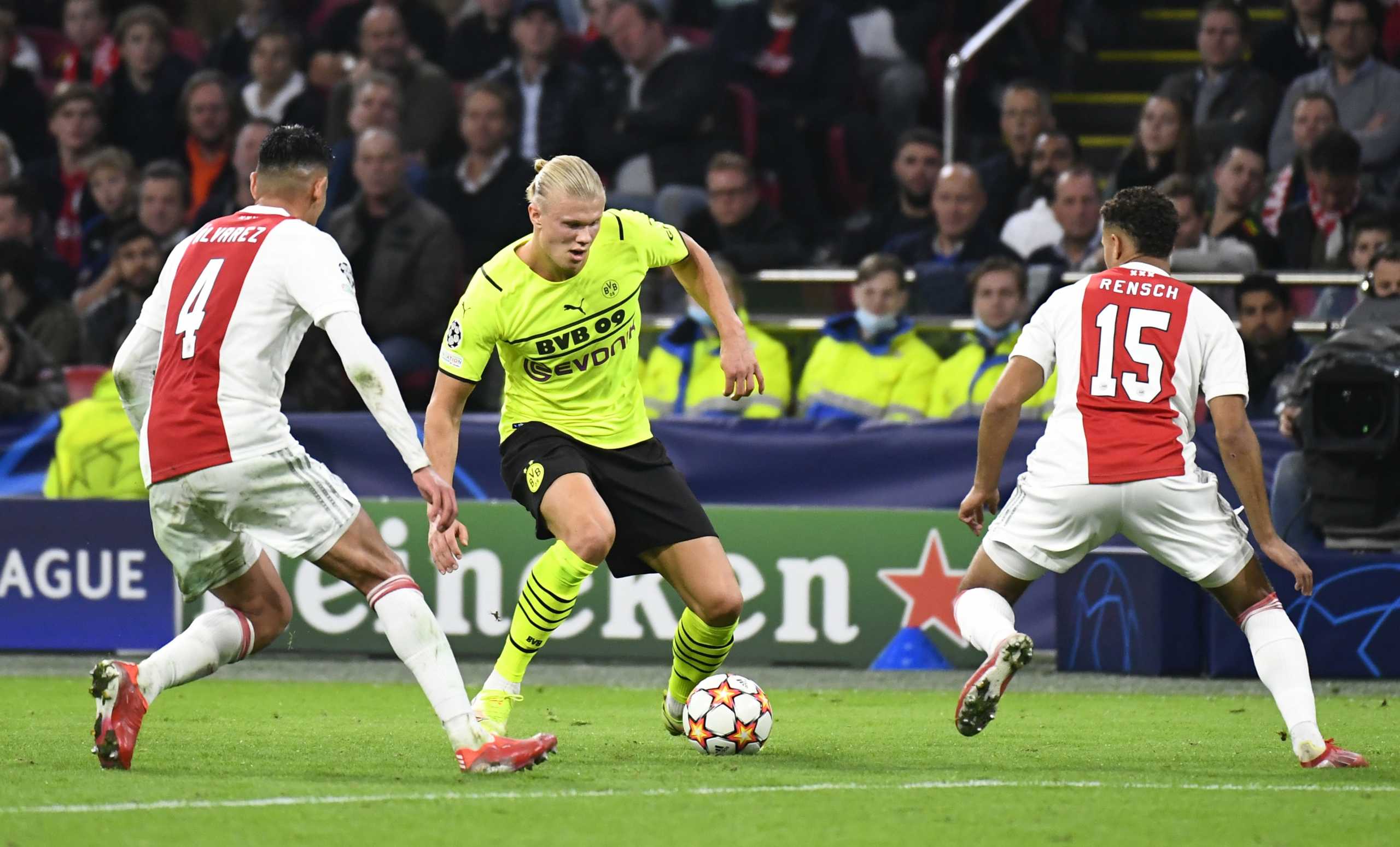 Soccer Football - Champions League - Group C - Ajax Amsterdam v Borussia Dortmund - Johan Cruijff Arena, Amsterdam, Netherlands - October 19, 2021 Borussia Dortmund's Erling Braut Haaland in action with Ajax Amsterdam's Devyne Rensch and Edson Alvarez REUTERS