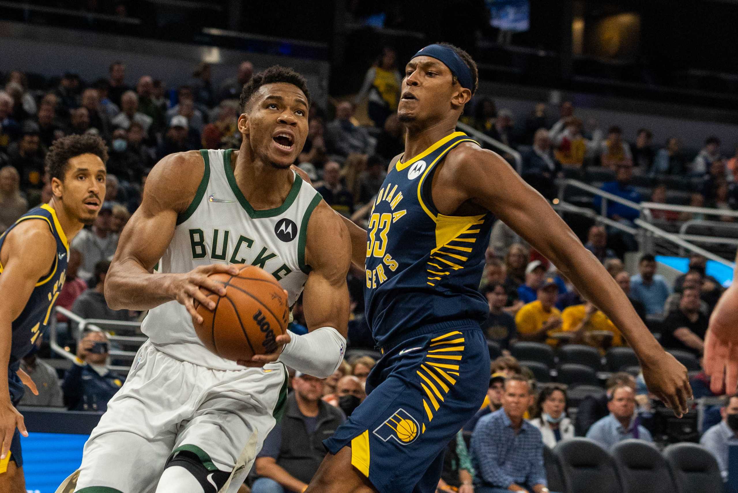 Oct 25, 2021; Indianapolis, Indiana, USA; Milwaukee Bucks forward Giannis Antetokounmpo (34) shoots the ball while Indiana Pacers center Myles Turner (33) defends in the first quarter at Gainbridge Fieldhouse. Mandatory Credit: Trevor Ruszkowski-USA TODAY Sports