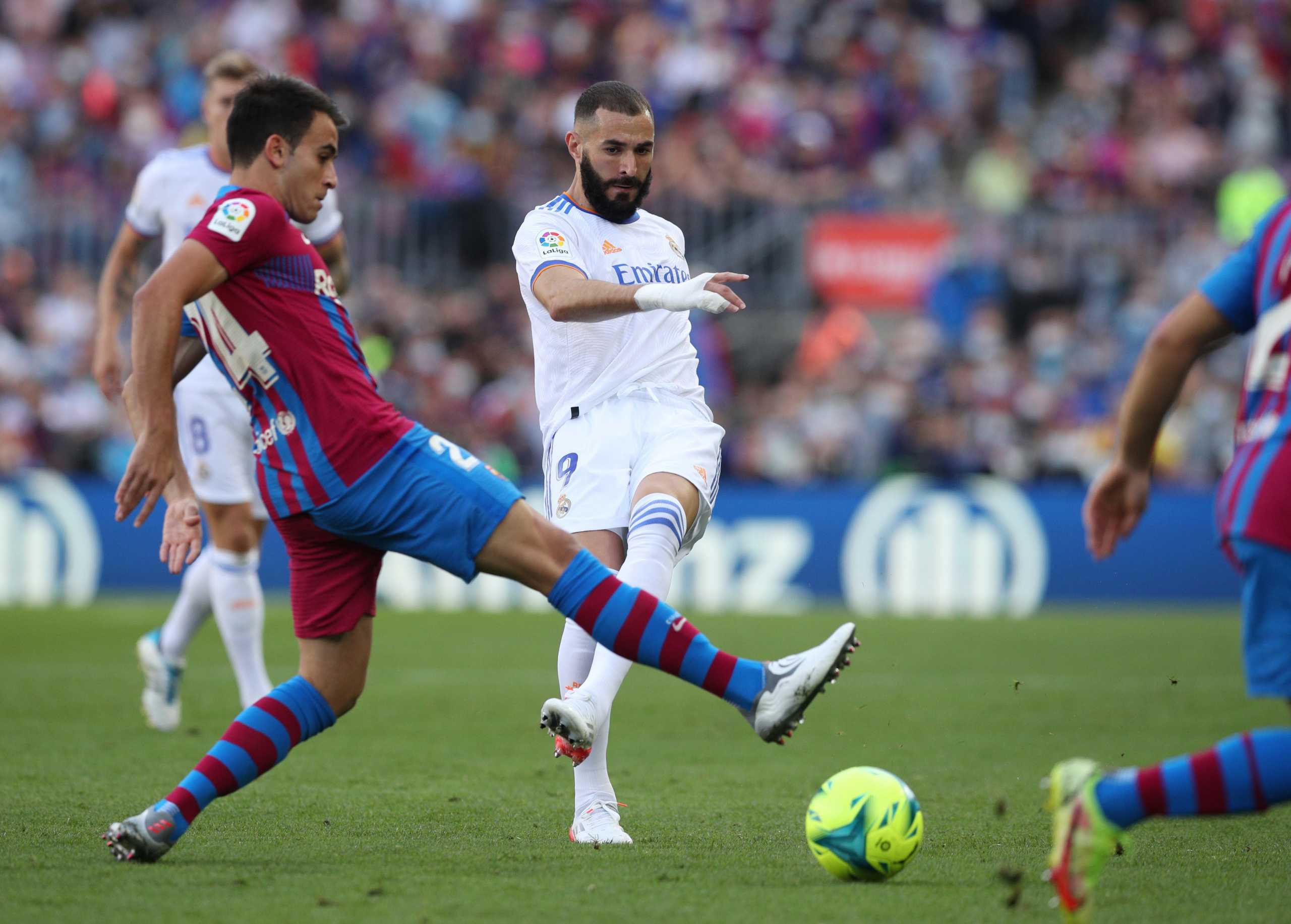 Soccer Football - LaLiga - FC Barcelona v Real Madrid - Camp Nou, Barcelona, Spain - October 24, 2021  FC Barcelona's Eric Garcia in action with Real Madrid's Karim Benzema REUTERS